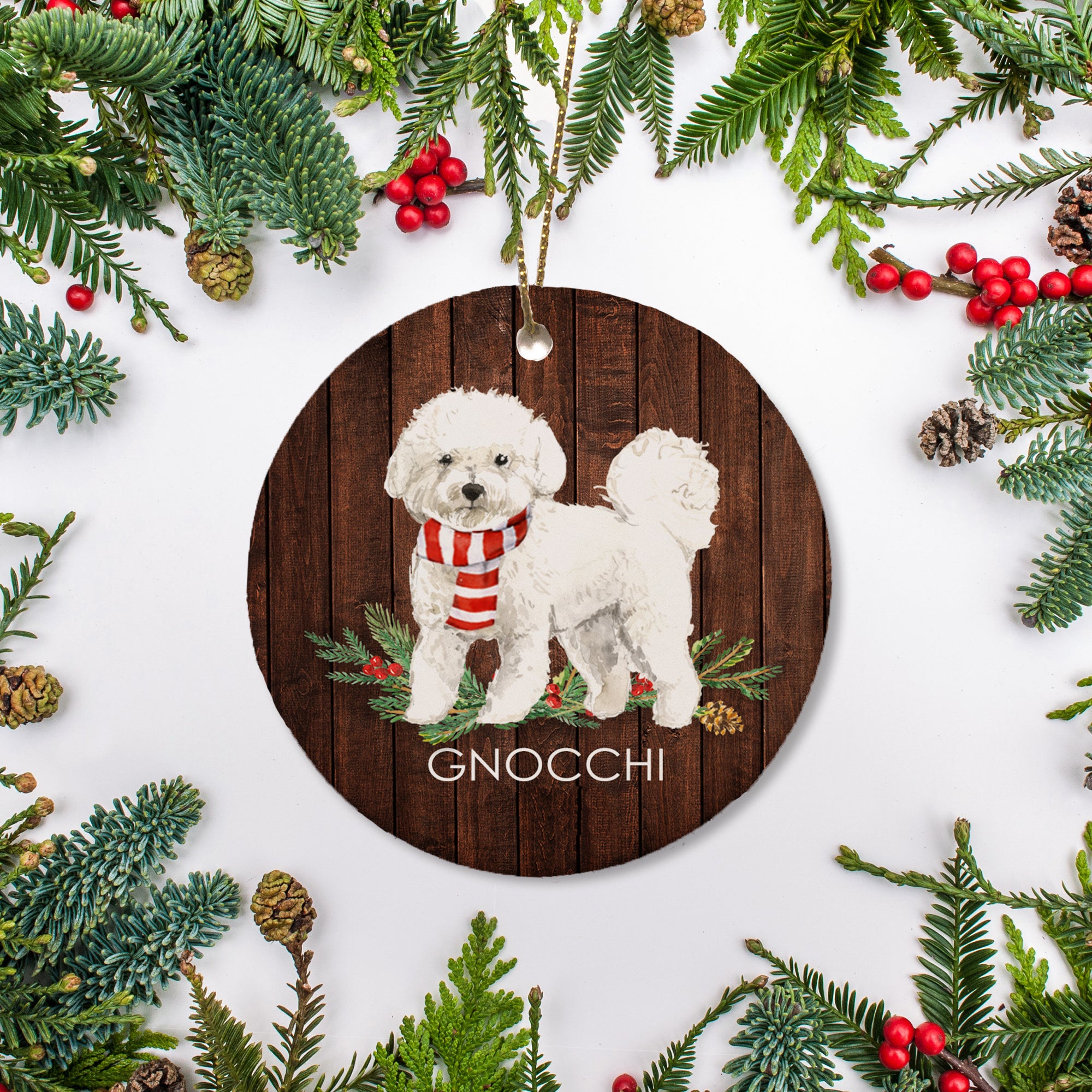 This personalized Christmas ornament features a Bichon Frise, personalized with your dog's name. It is a lovely gift for any pet lover or way to commemorate your fur baby's first Christmas.