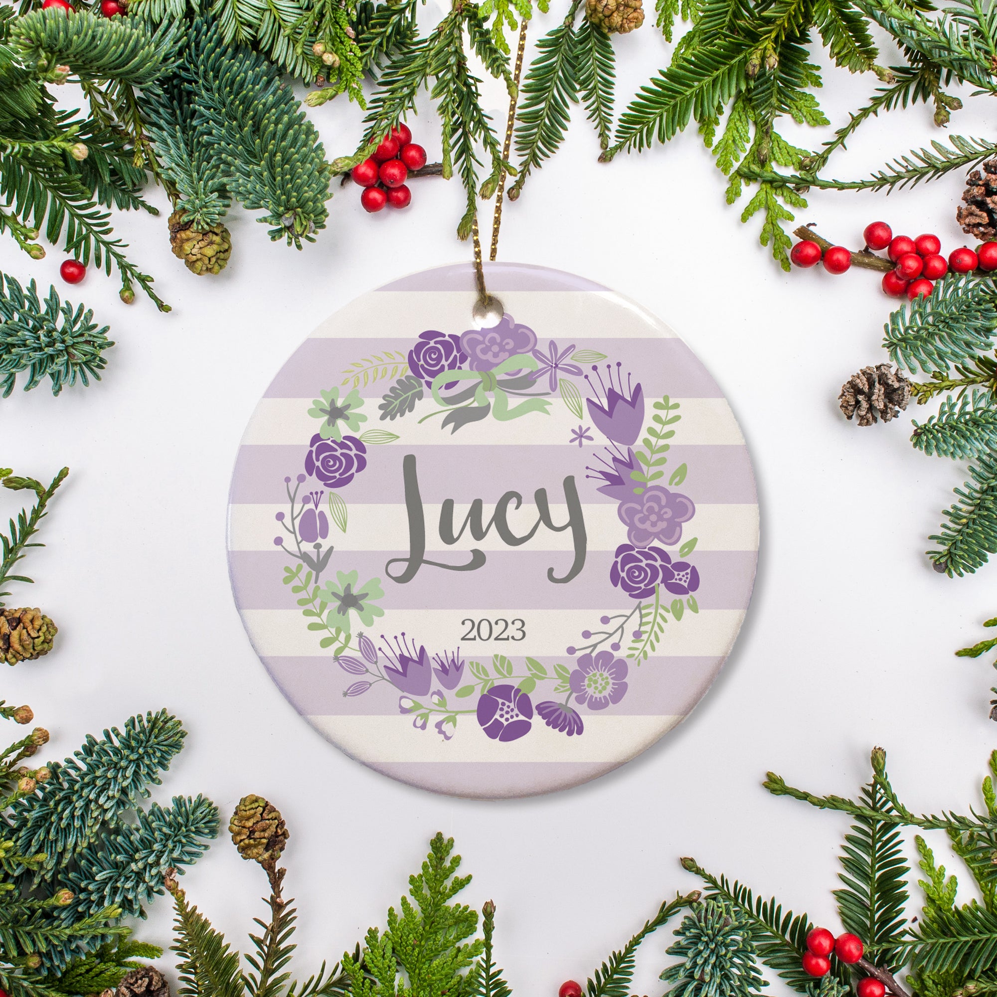 Personalized Christmas Ornament with name and year - purple and white stripes and a floral wreath surrounding the name | PIPSY.COM