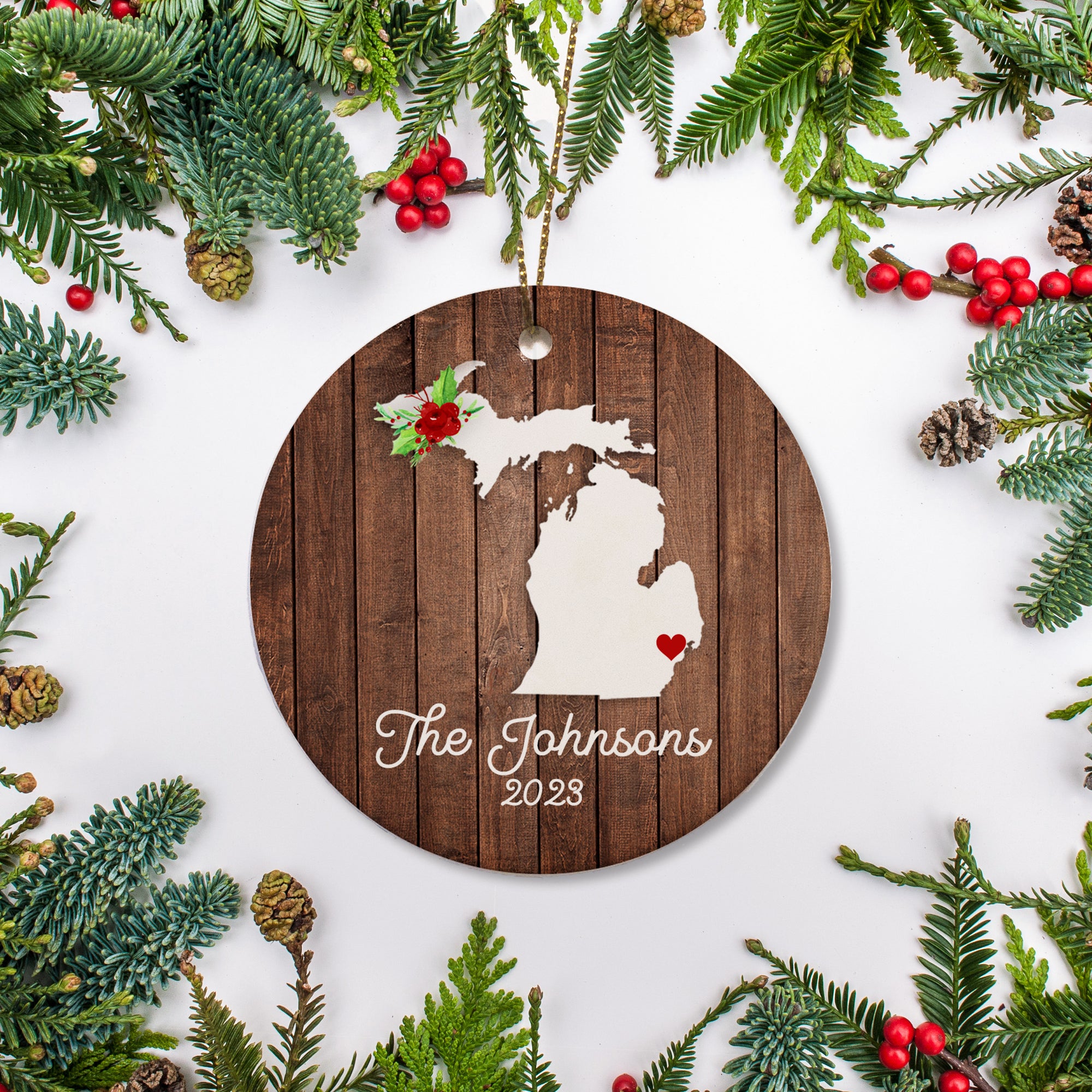 Michigan state christmas ornament. Personalized with your name, city, and year. Ceramic keepsake ornament with a gold hanging string. Great for a college student, new home owners, just moved, or vacation memory