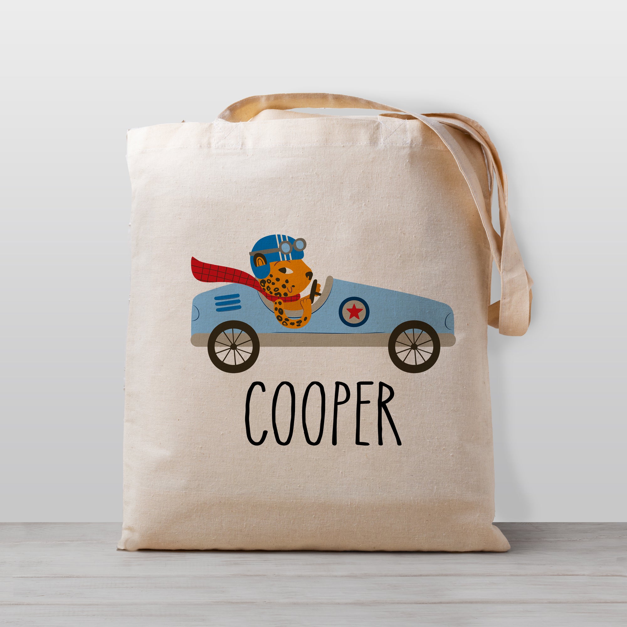 Race Car Personalized tote bag, featuring a light blue race car driven by a cheetah, 100% natural cotton canvas bag - great for daycare, preschool, or toys