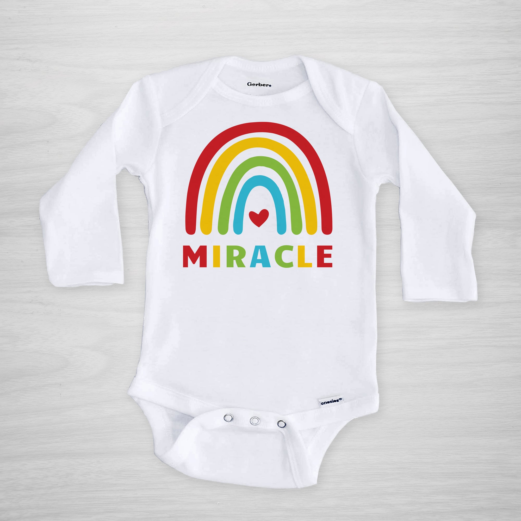 Miracle Rainbow Baby Onesie® in primary colors, long sleeved