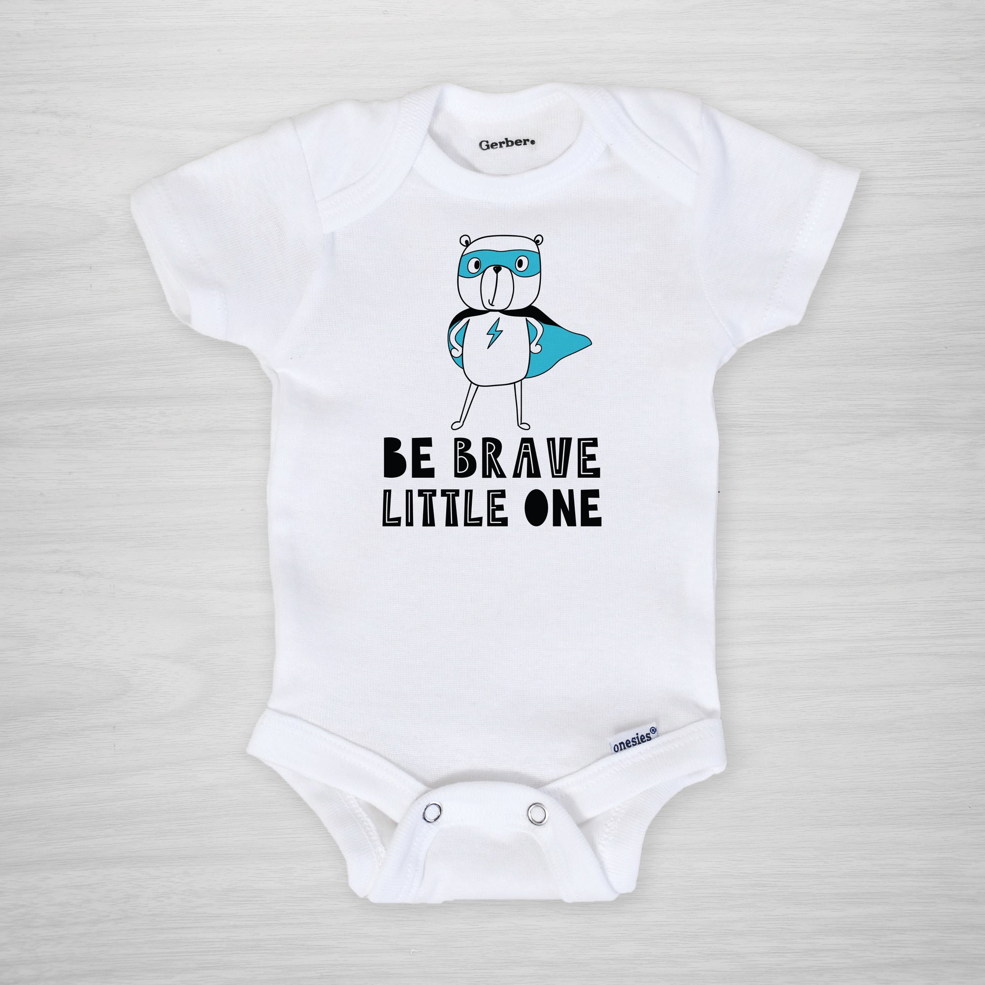 Be Brave Little One Onesie®, with a blue superhero bear, show how brave your little NICU warrior is during his hospital stay, short sleeved