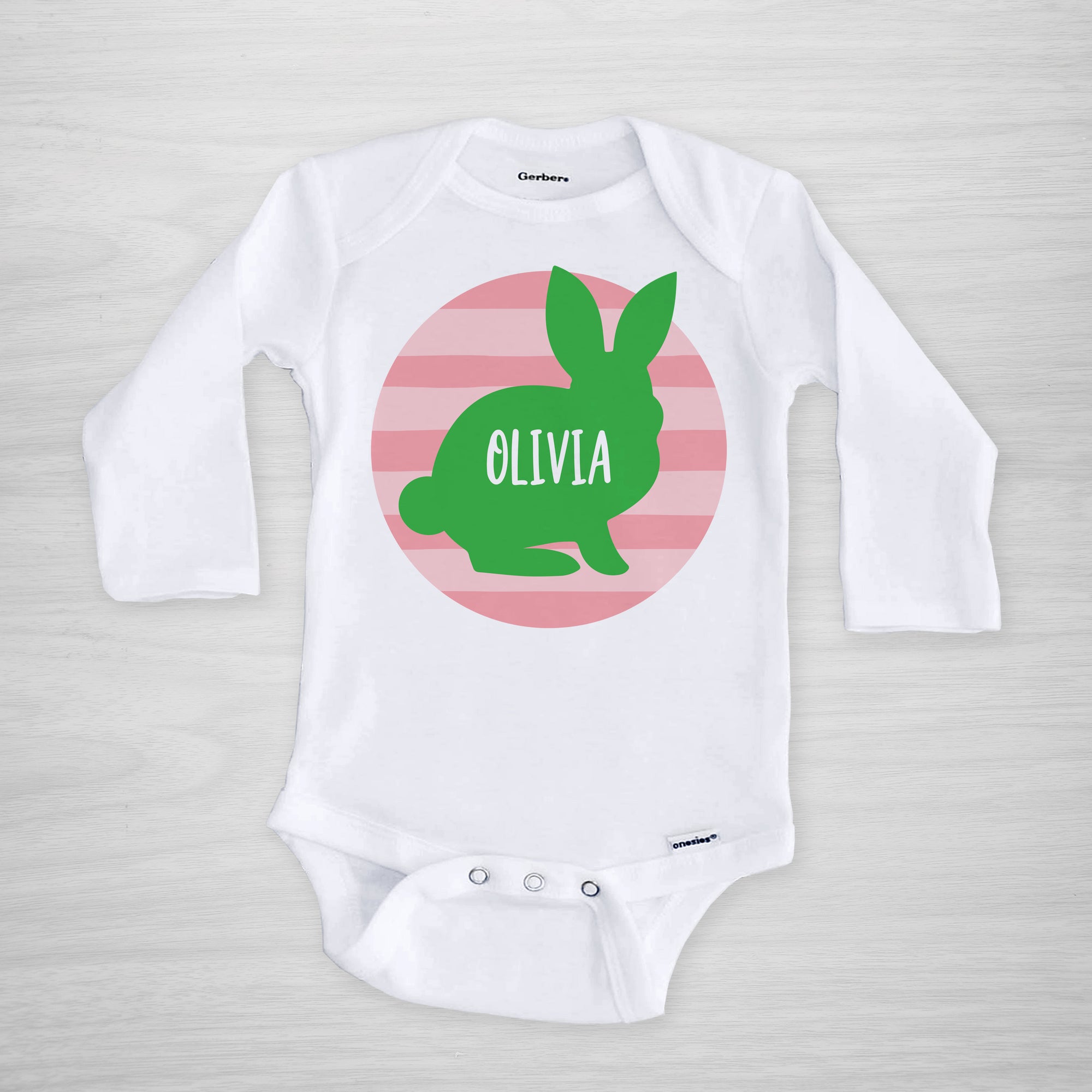 Personalized Easter Onesie, featuring a bunny silhouette on a pink striped circle, long sleeved