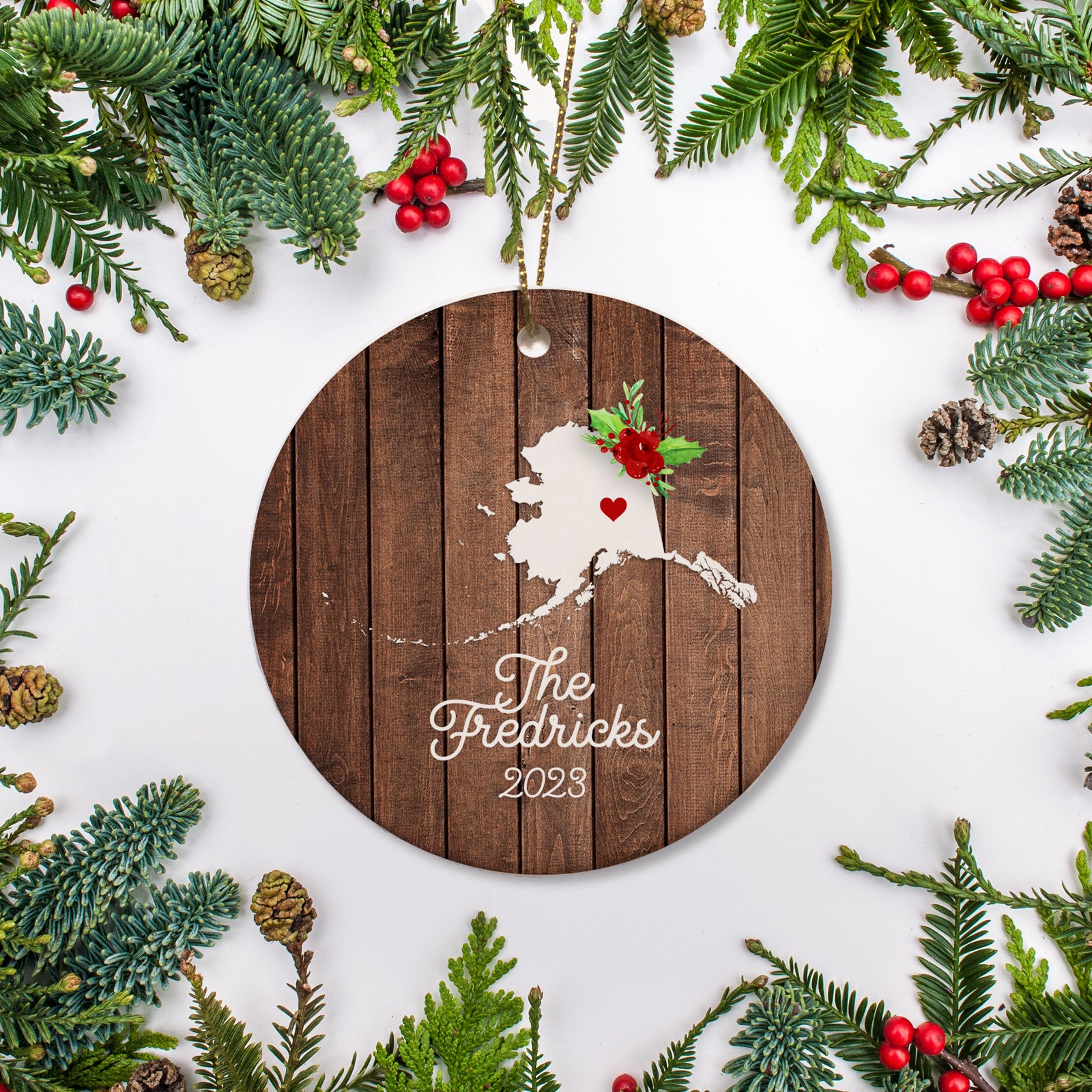 Alaska state christmas ornament. Personalized with your name, city, and year. Ceramic keepsake ornament with a gold hanging string. Great for a college student, new home owners, just moved, or vacation memory