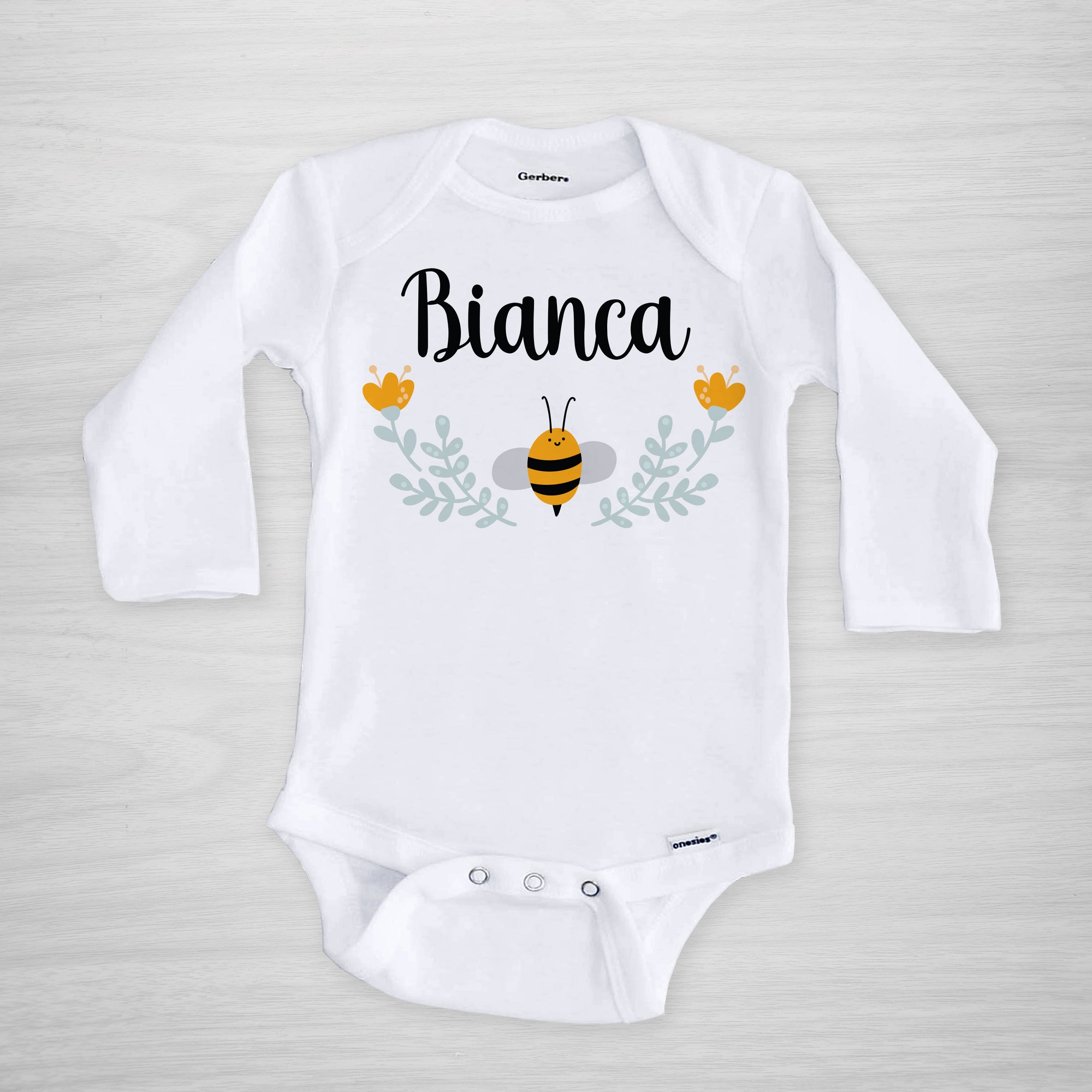 Bee Personalized onesie, featuring a sweet little bumblebee and a floral frame, genuine Gerber Onesies®, long sleeved