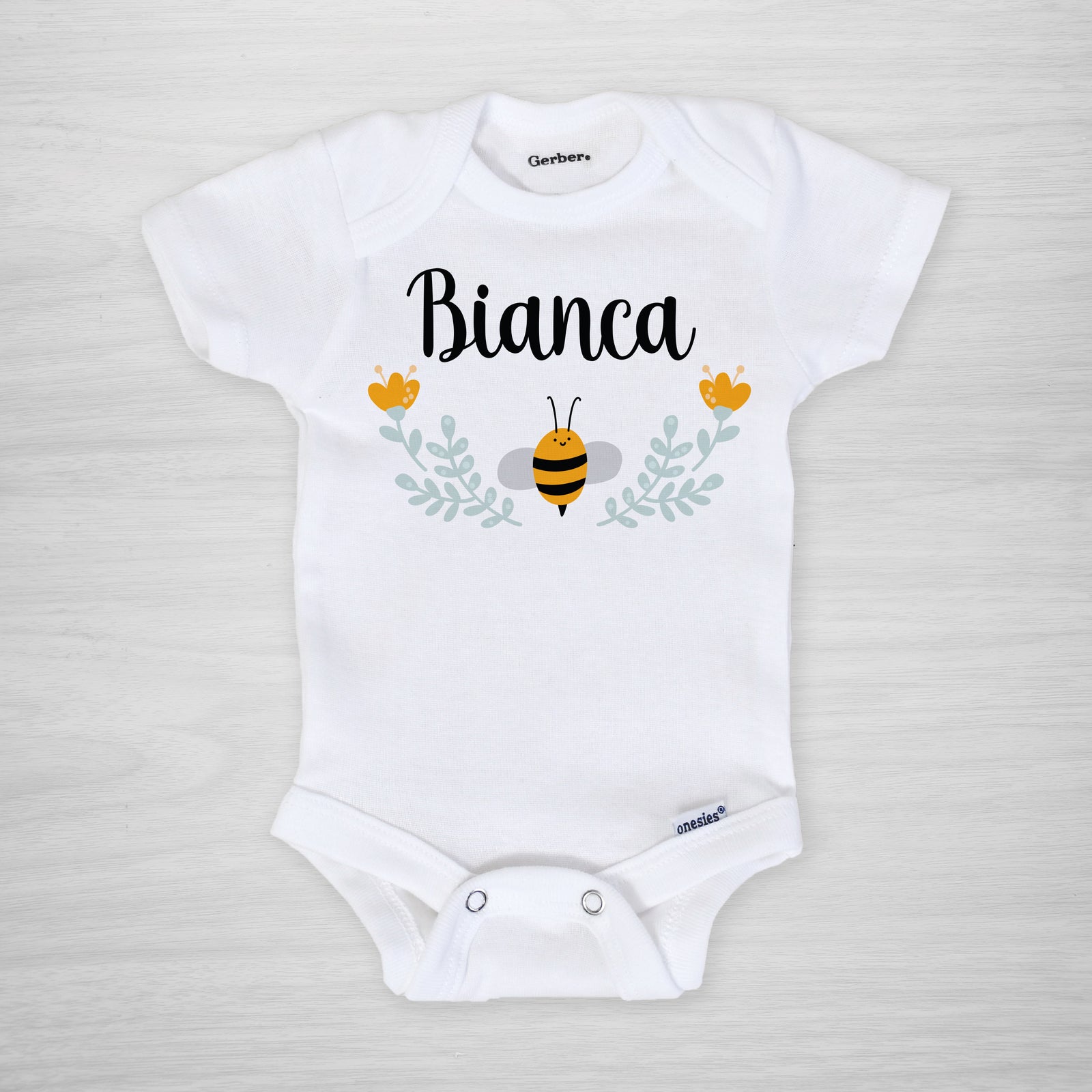 Bee Personalized onesie, featuring a sweet little bumblebee and a floral frame, genuine Gerber Onesies®