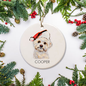 This personalized Christmas ornament features a Bichon Frise in a cute santa hat. It is a lovely gift for any pet lover or way to commemorate your fur baby's first Christmas.&nbsp;