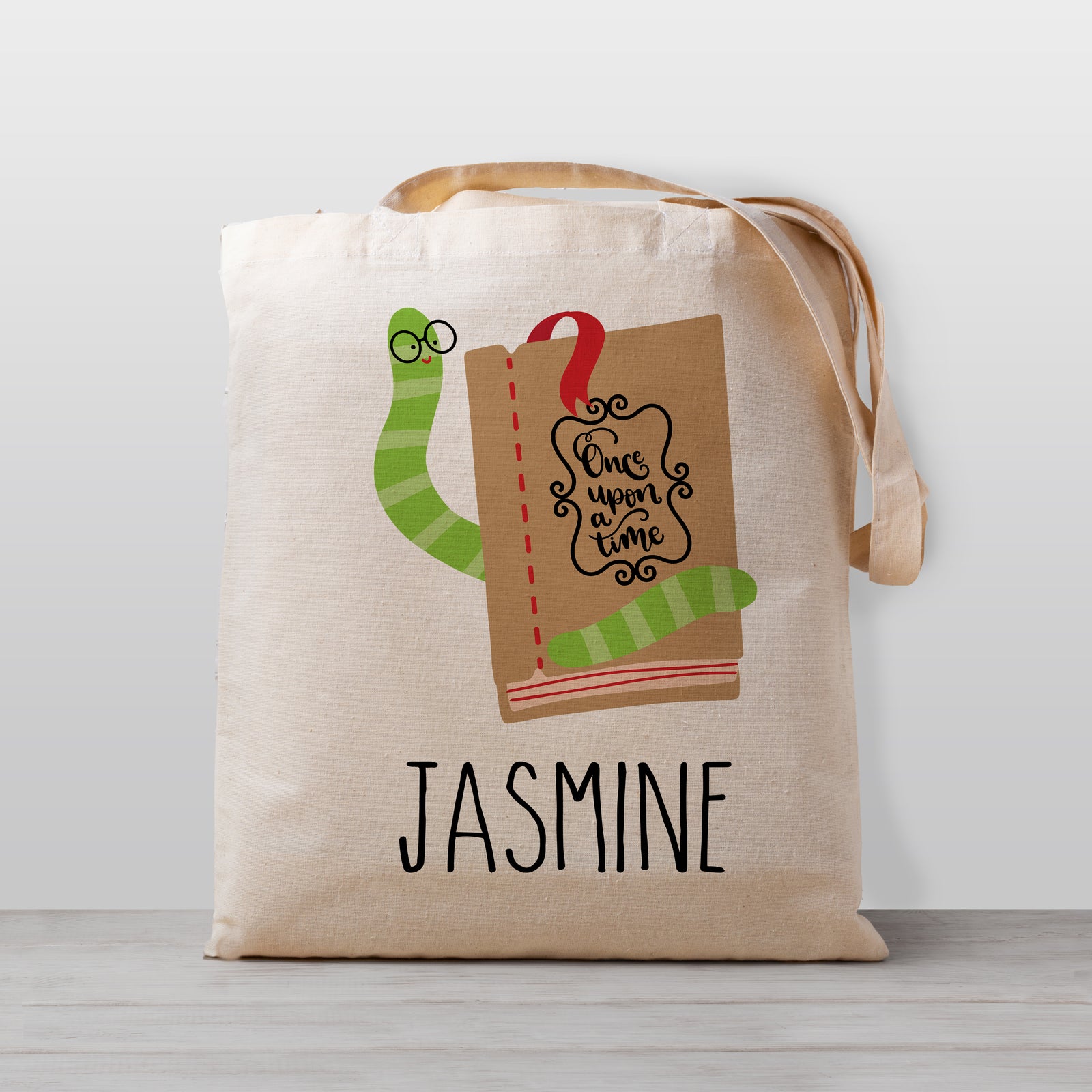 Kids library book bag, personalized with a book work on a stack of books. 100% natural cotton canvas