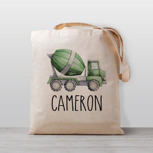 A personalized cement mixer truck construction tote bag, perfect for carrying your little one's stuff to preschool, kindergarten, or to use as a library book bag.
