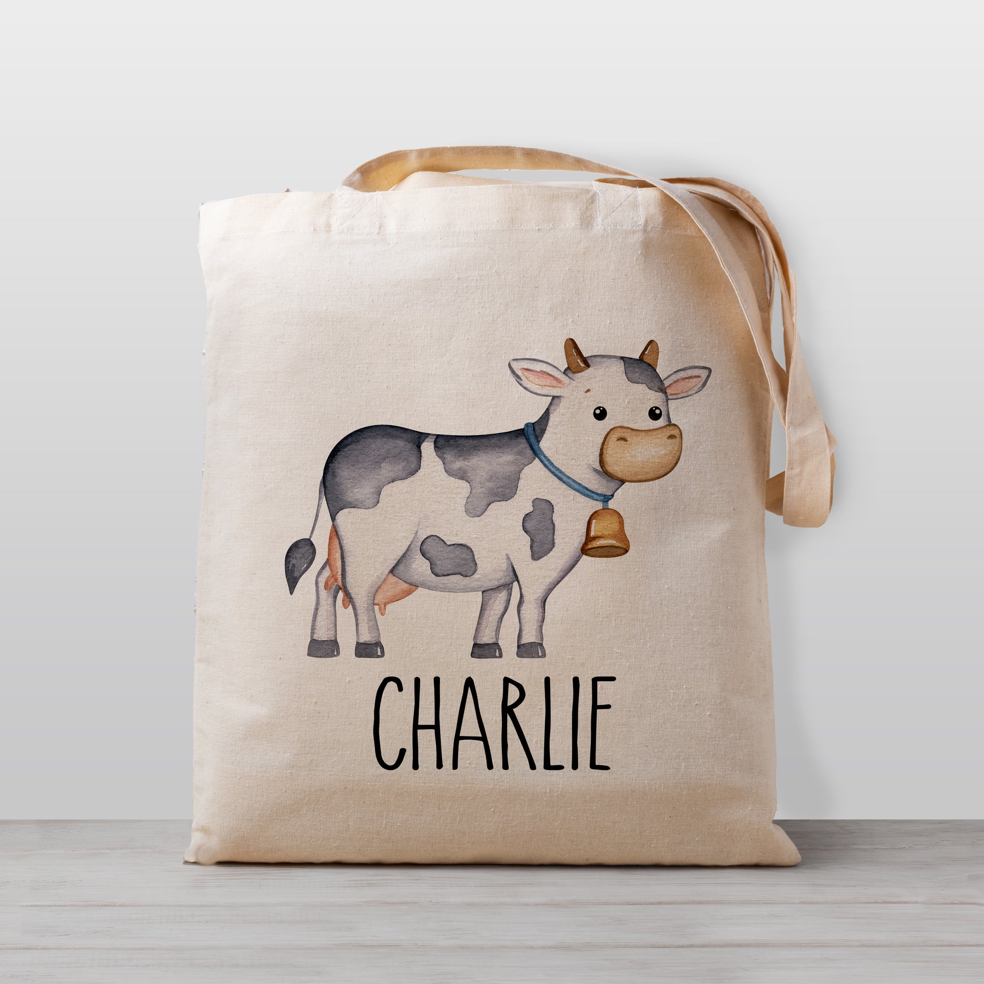 Cow tote bag for kids, personalized with your child's name. Great for daycare, preschool, or just hauling your toys around. 100% natural cotton canvas, and sized so they are easy for your little one to carry