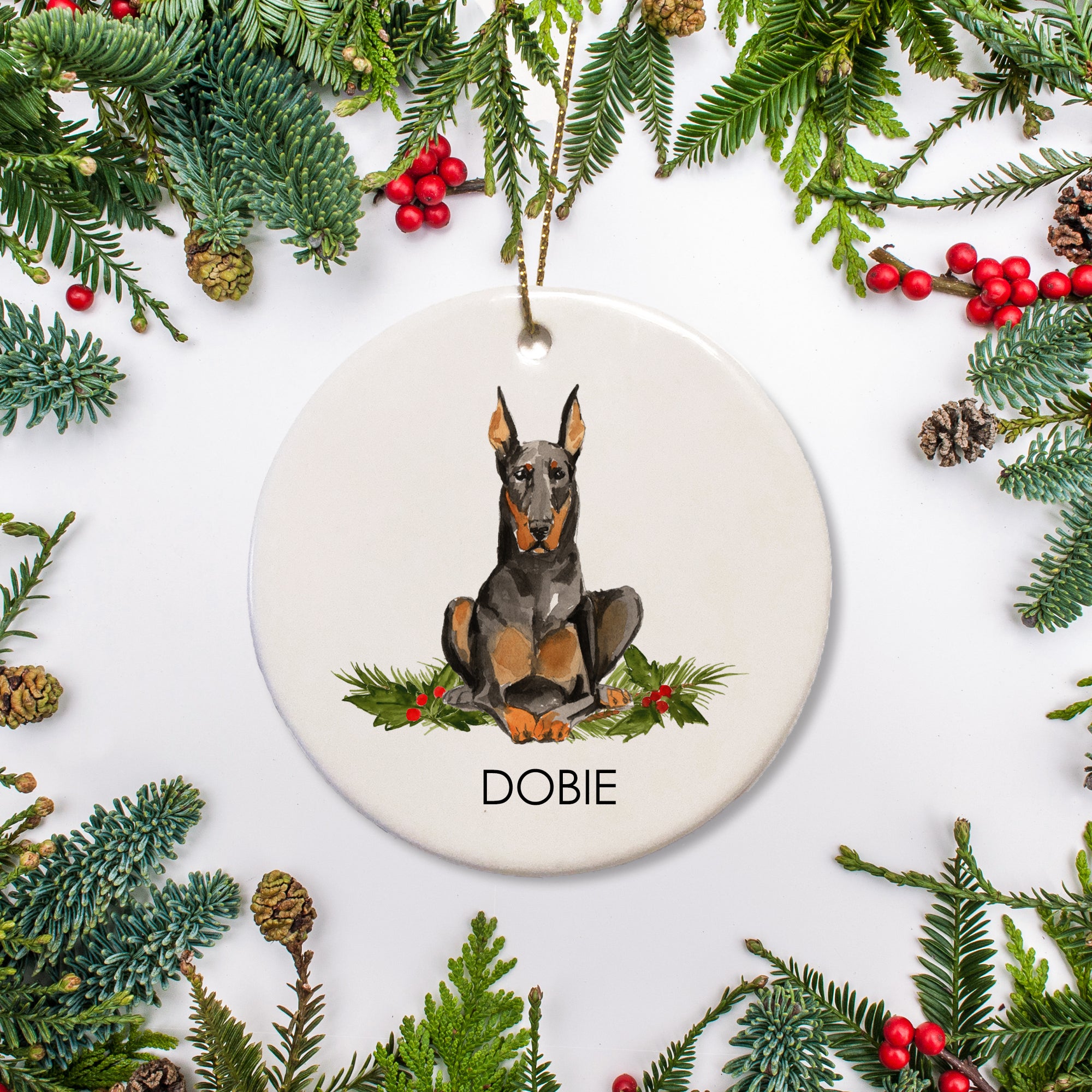 This custom ornament features your beloved Doberman Pincher and is personsonalized with their name. It makes a perfect keepsake gift, or a great way to celebrate your little dobie's first Christmas.