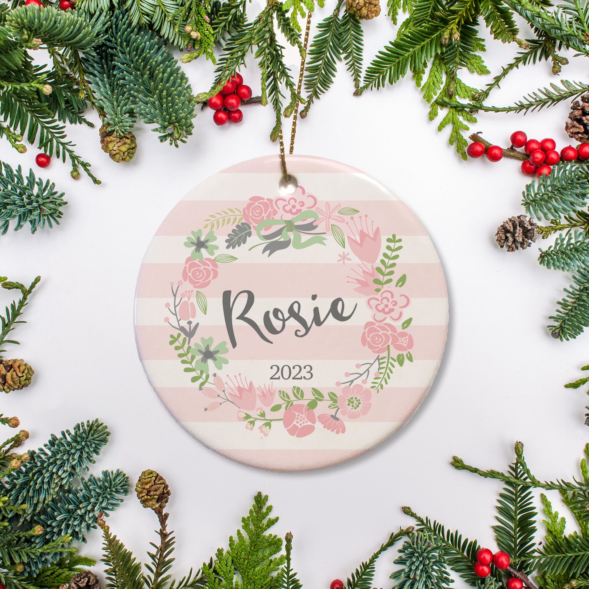 Personalized Christmas Ornament, pink and white stripes with a pink floral wreath. Personalize with name and year of your choice | PIPSY.COM