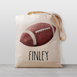 Football tote bag for kids, personalized with your child's name. Gender neutral so it's good for boys or girls. printed on 100% natural cotton canvas in our Nashville studio