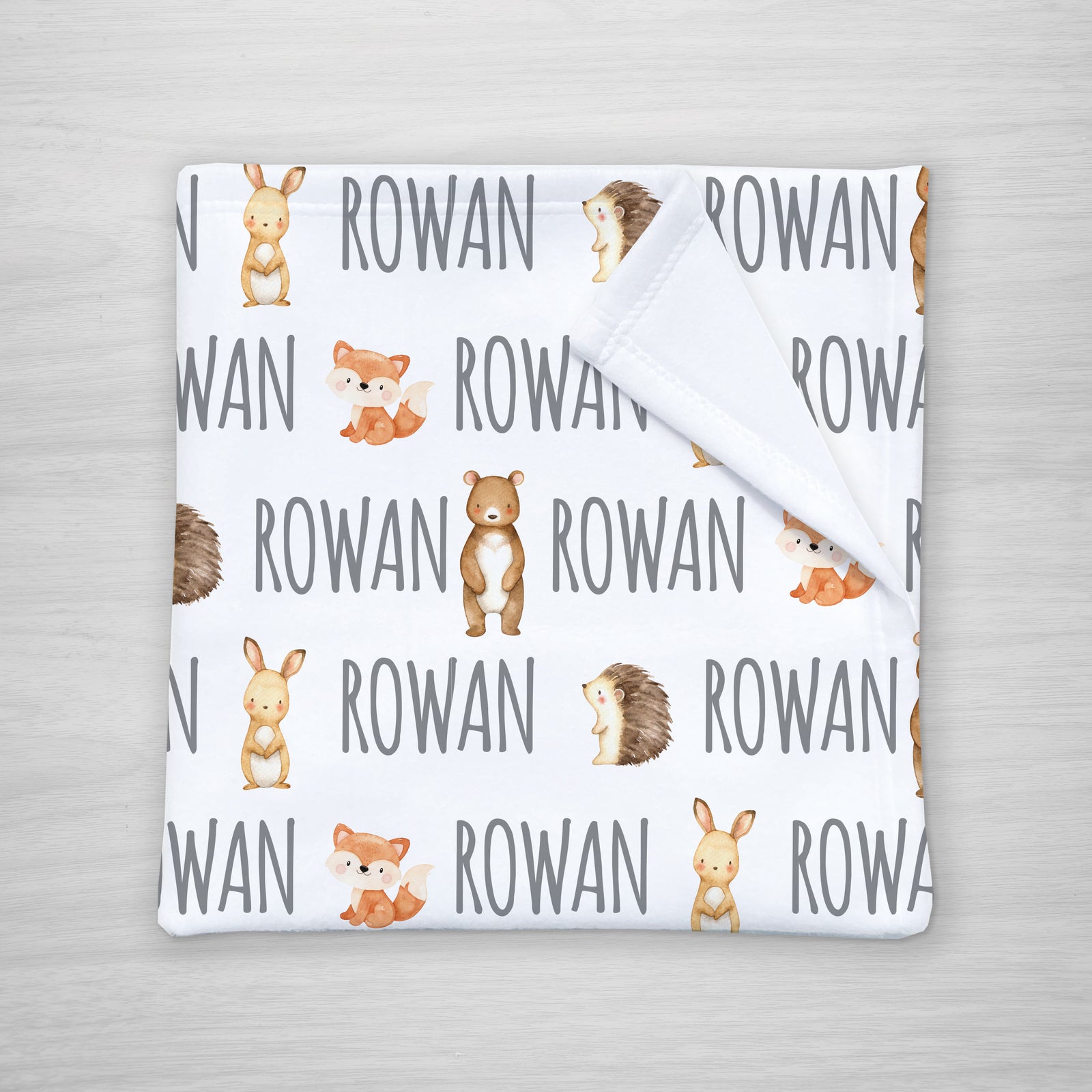 Forest friends personalized kids blanket featuring a bunny, bear, fox, and hedgehog, super soft fleece