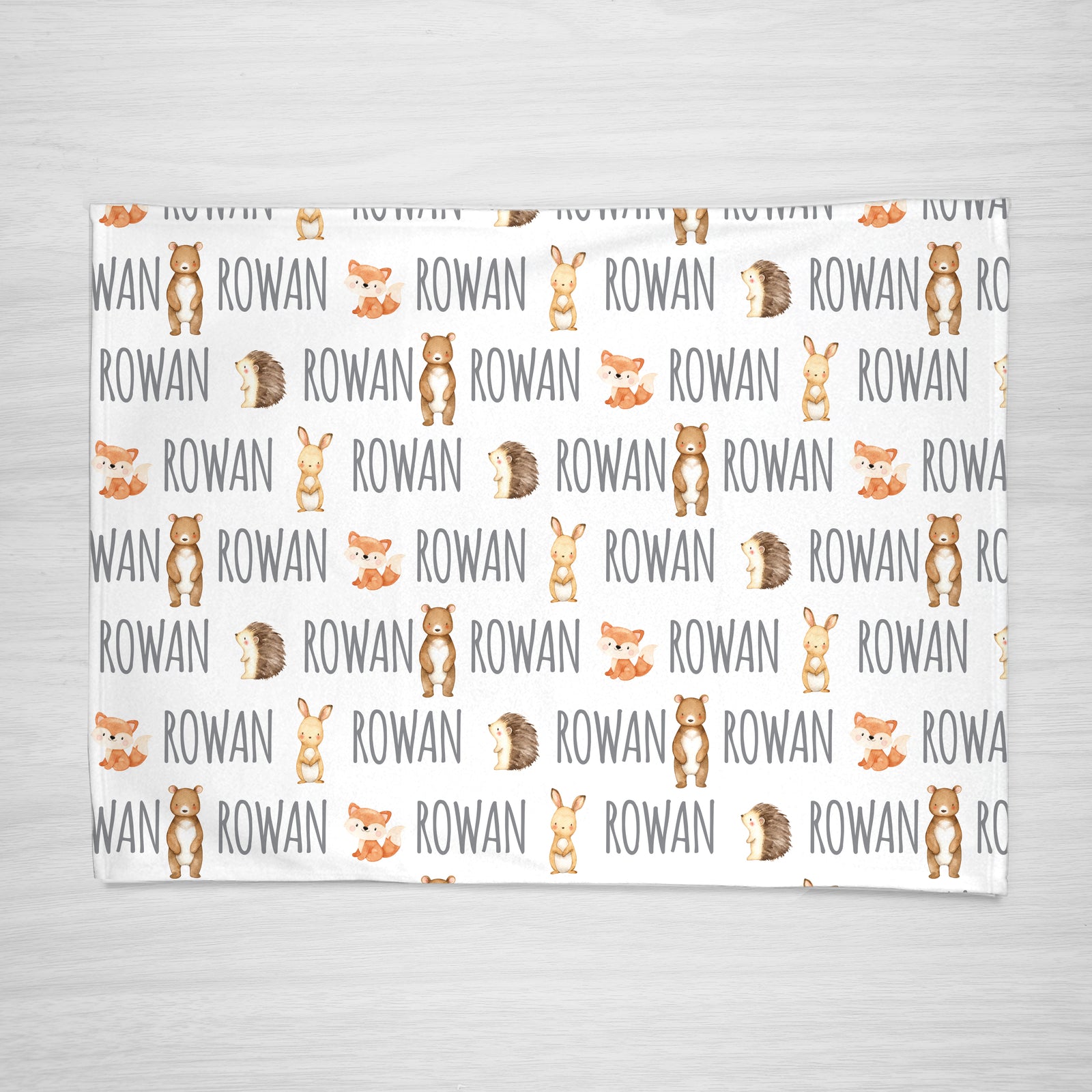 Forest friends personalized kids blanket featuring a bunny, bear, fox, and hedgehog, super soft fleece