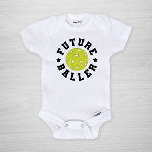 Future Baller Pickleball Gerber Onesie®. You can leave a note and specify team colors for the text. Otherwise, the print will be black as shown. Makes a great baby shower gift for your favorite picklehead.