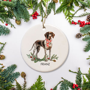 Decorative ceramic Christmas ornament with a German Short Hair Pointer dog illustration and festive elements on a white background.