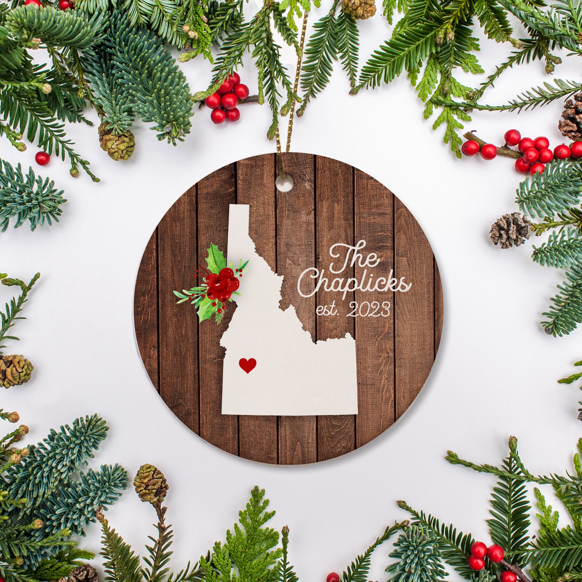 Idaho state christmas ornament. Personalized with your name, city, and year. Ceramic keepsake ornament with a gold hanging string. Great for a college student, new home owners, just moved, or vacation memory