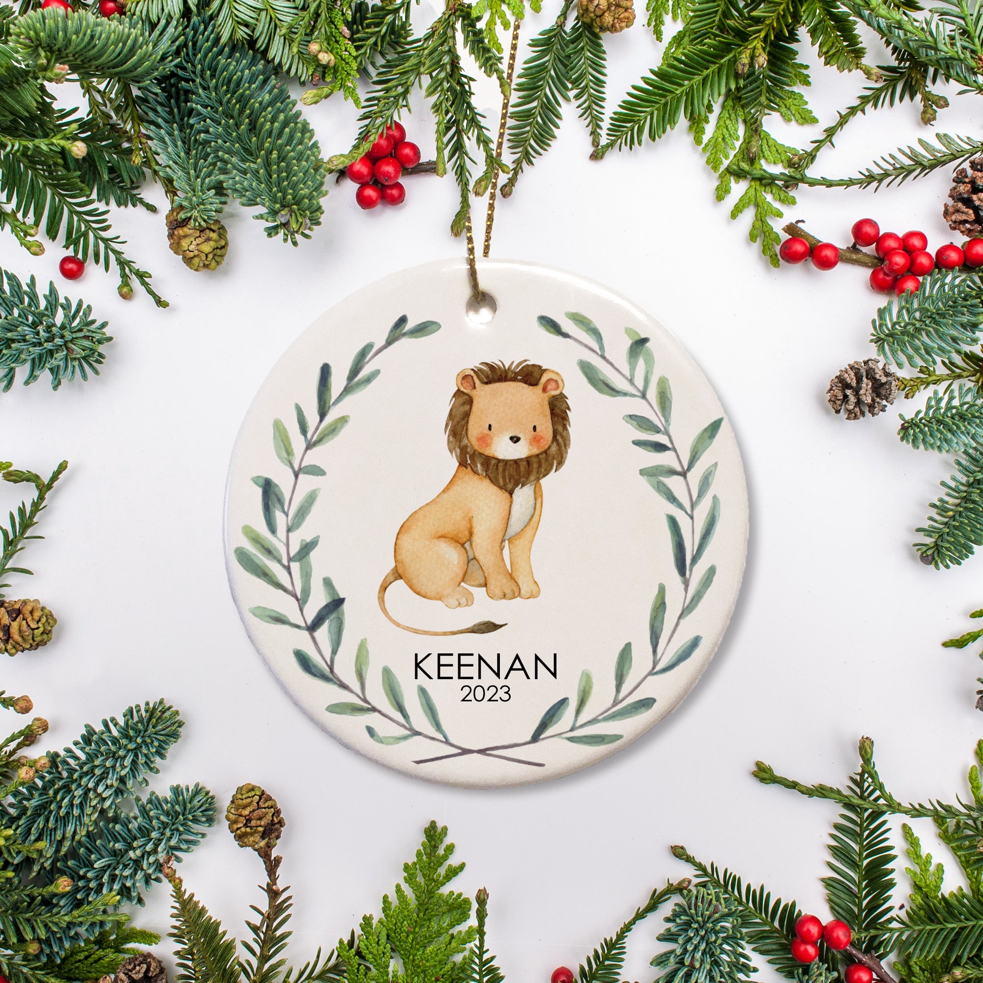 This personalized jungle ornament features a watercolor lion, along with the name and year of your choice. It is a lovely gift for a child or way to commemorate baby's first Christmas. You can even add a special message on the back!