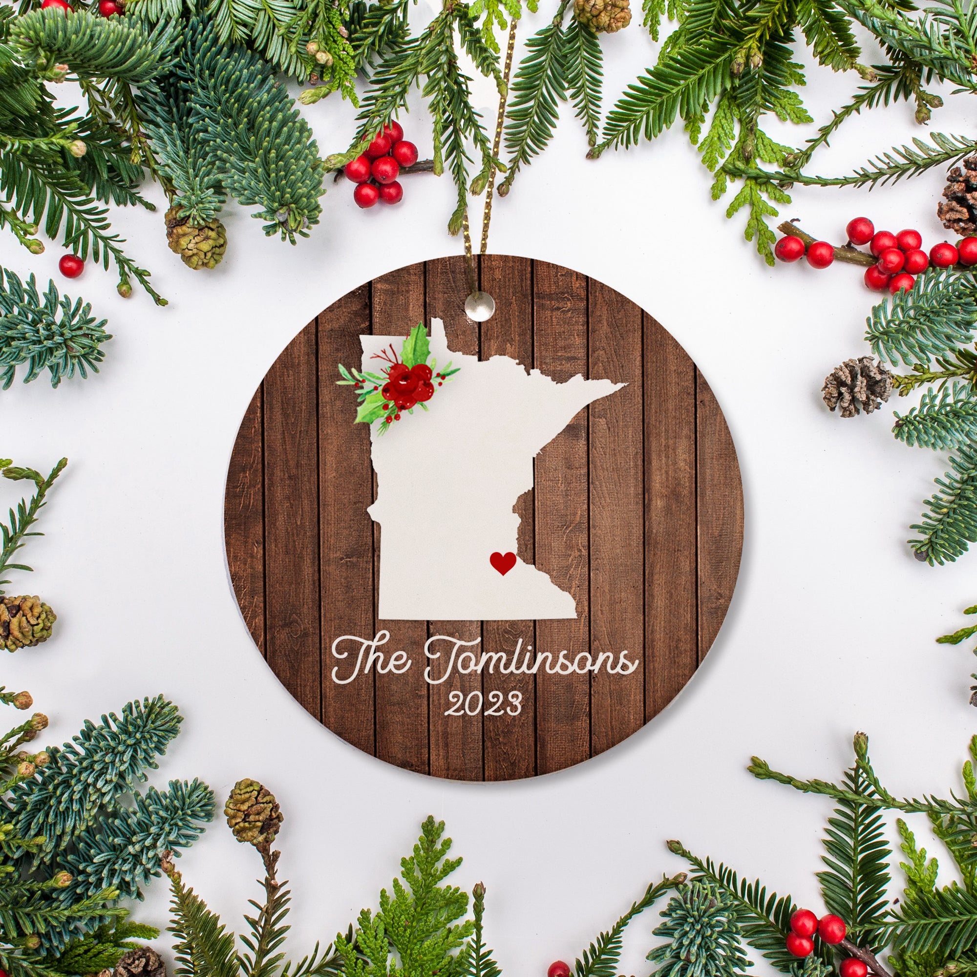 Minnesota state christmas ornament. Personalized with your name, city, and year. Ceramic keepsake ornament with a gold hanging string. Great for a college student, new home owners, just moved, or vacation memory