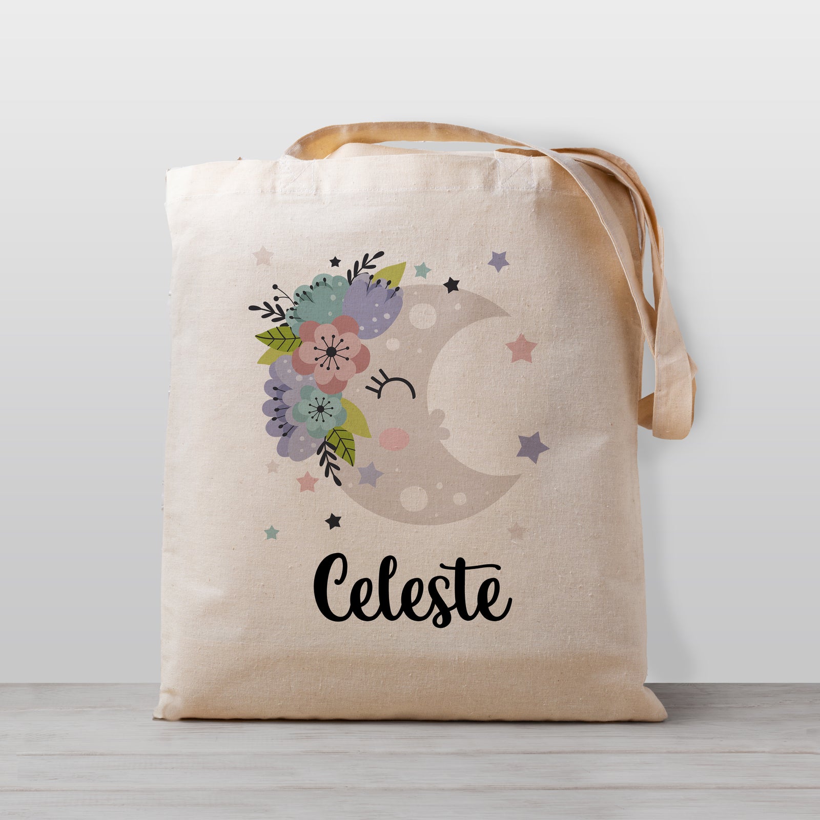 Moon Tote bag for kids, Moon has a cute kawaii face with flowers and stars. Personalized with your child&#39;s name. 100% natural cotton canvas. Printed with child-safe inks in our Nashville studio.