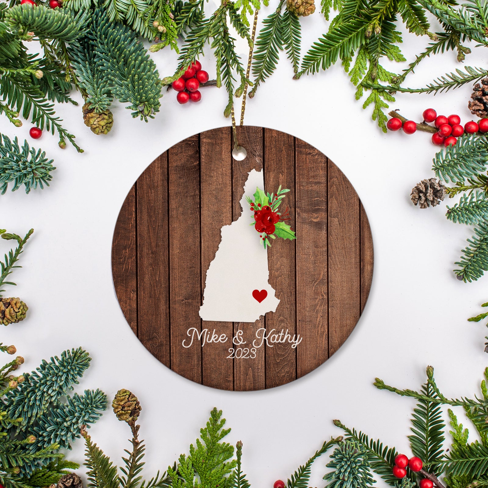 New Hampshire state christmas ornament. Personalized with your name, city, and year. Ceramic keepsake ornament with a gold hanging string. Great for a college student, new home owners, just moved, or vacation memory