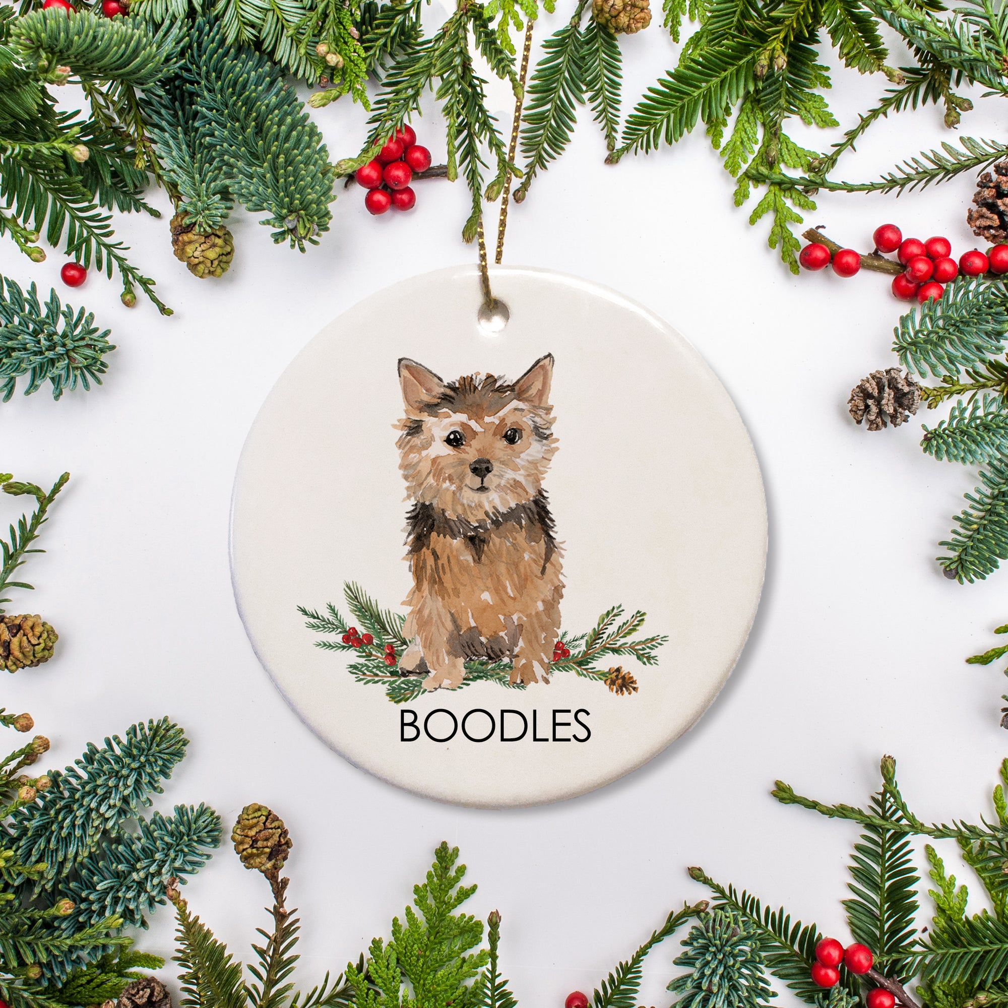 Norwich Terrier Personalized Christmas ornament, personalized with your dog's name. Printed on a sturdy ceramic ornament in our Nashville studio