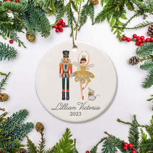 A keepsake ornament of the Nutcracker and the ballerina featuring the name and the date.