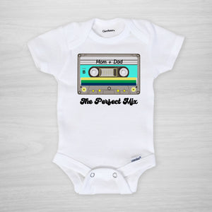 The Perfect Mix Onesie, featuring a retro 80s cassette mix tape with "mom + dad" written on it, custom printed in our Nashville studio on genuine Gerber Onesies, short sleeved