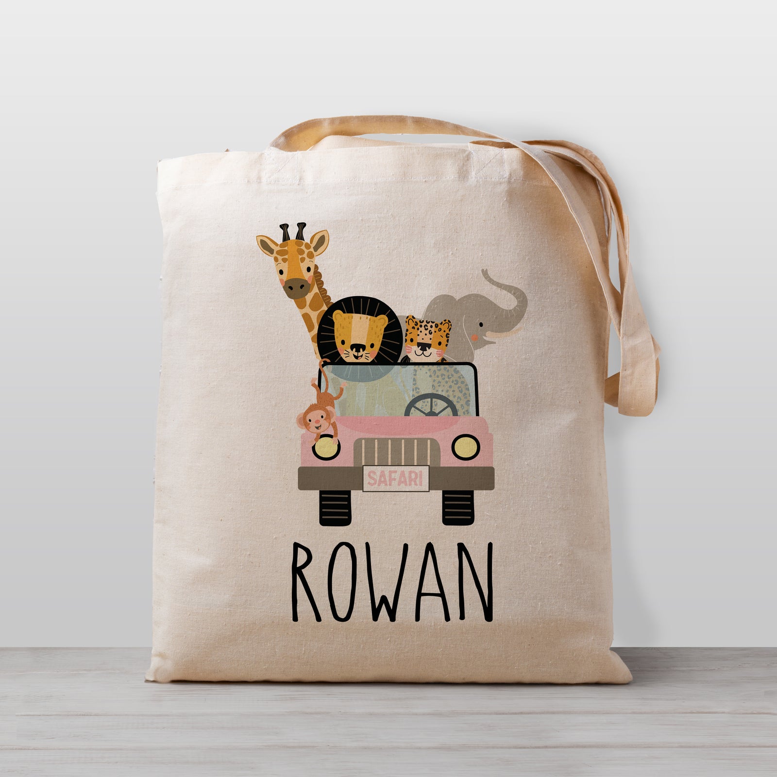 A cute safari jeep tote - loaded with a lion, cheetah, elephant, giraffe and monkey. Great for daycare or preschool, or as a library book bag. 100% Natural cotton canvas