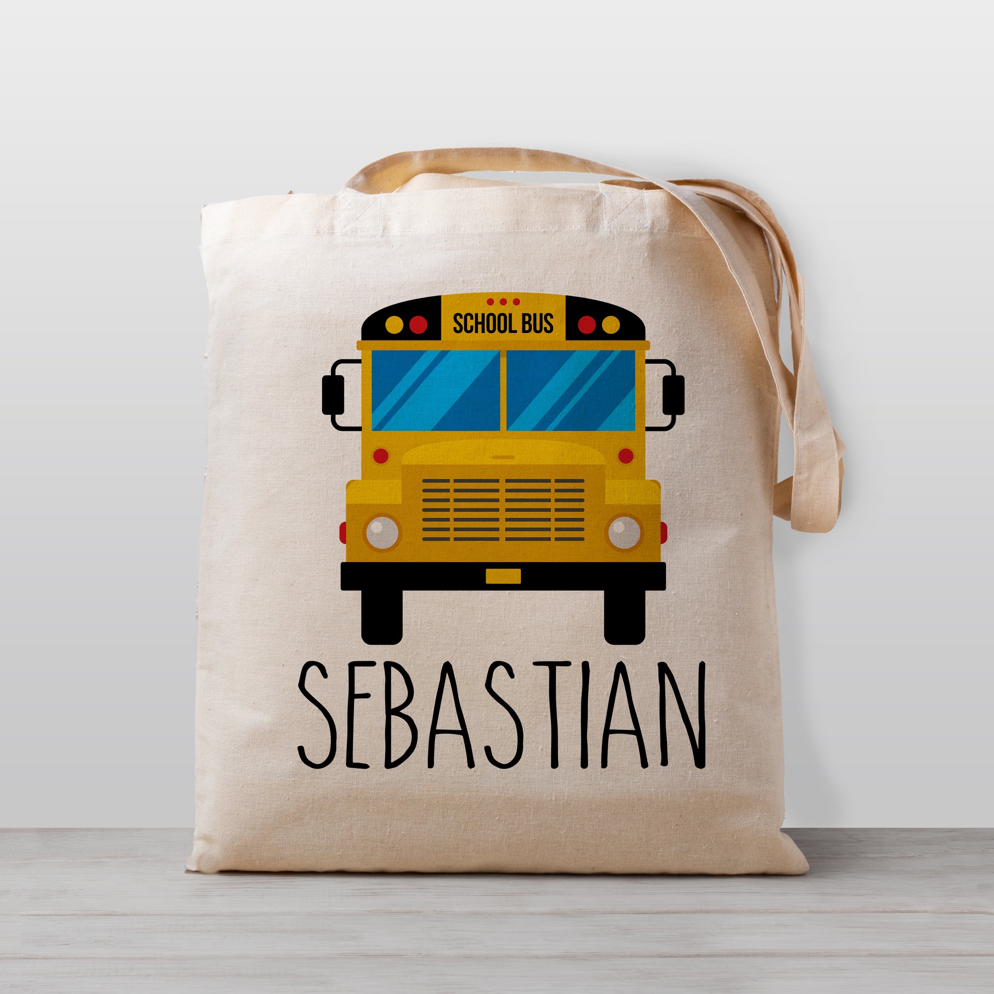 A school bus personalized tote bag, perfect for carrying your little one's stuff to preschool or kindergarten. Works great as a library book bag, too! , 100% natural cotton canvas