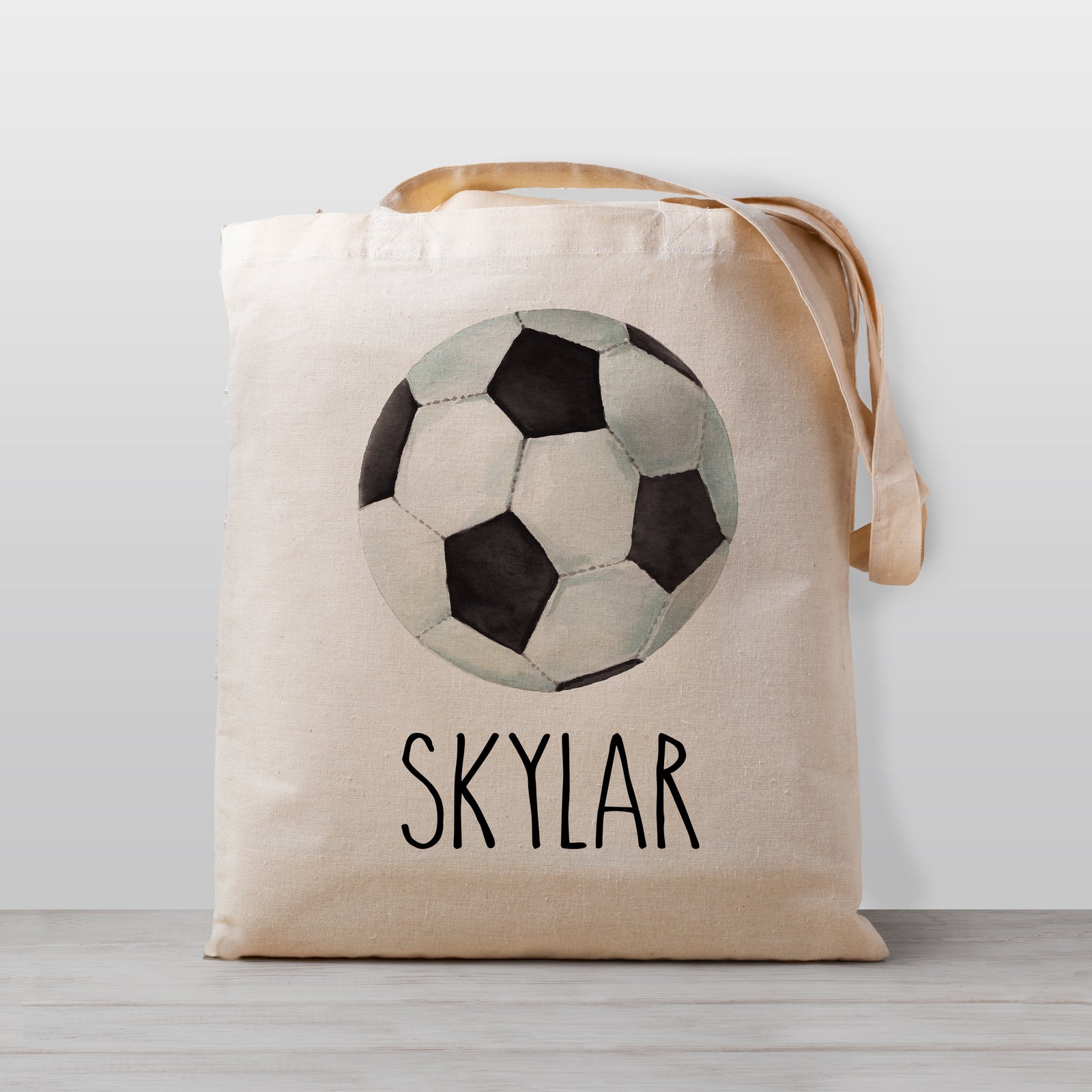 A soccer tote bag, Personalized with your child's name. Perfect for carrying your little one's stuff to preschool, daycare, the library, or bringing favorite books over to Grandma's house. 