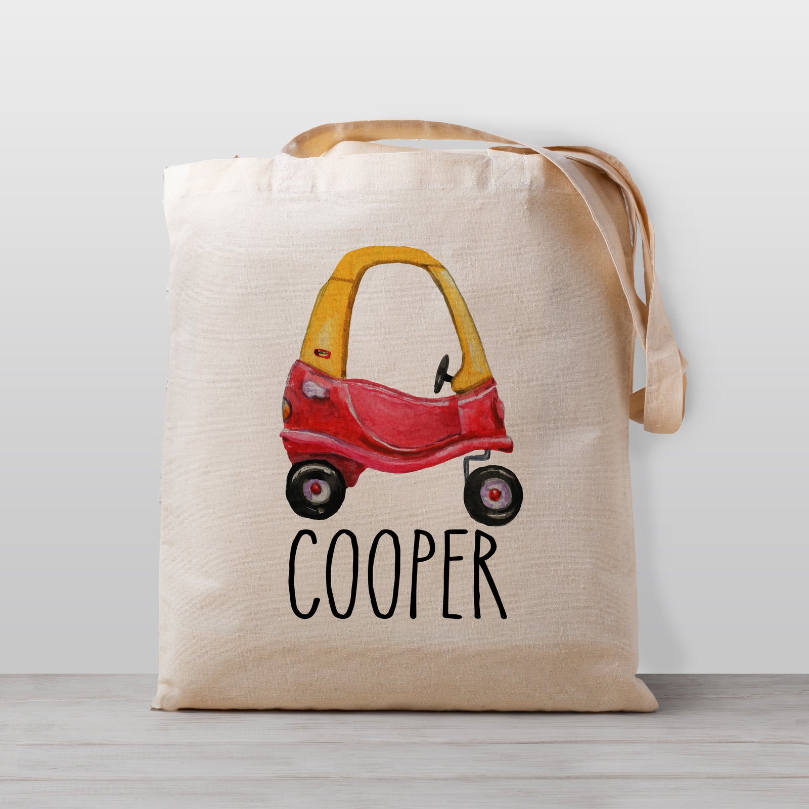 A toy car personalized tote bag, perfect for carrying your little one's stuff to preschool or kindergarten. Works great as a library book bag, too! 