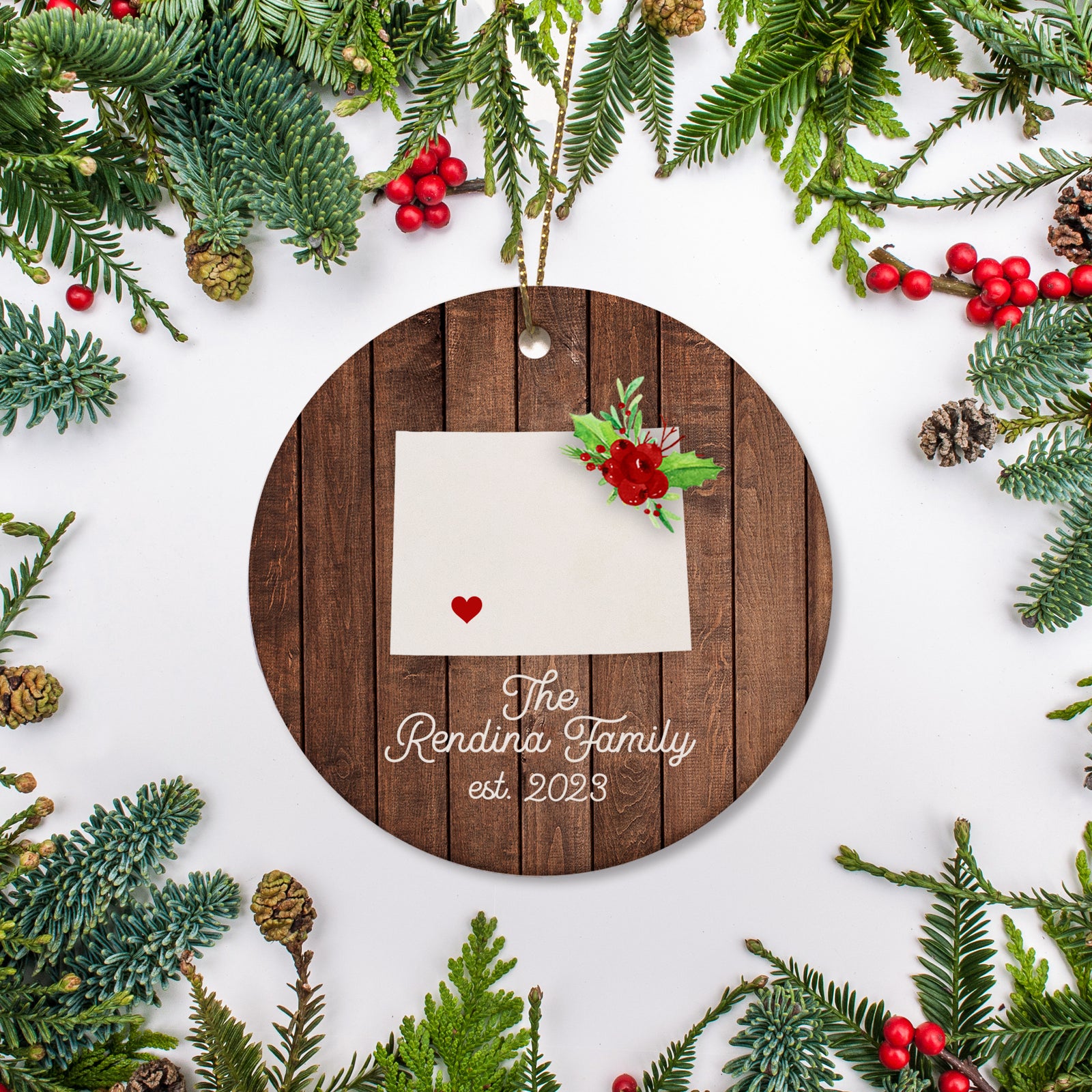 Wyoming state christmas ornament. Personalized with your name, city, and year. Ceramic keepsake ornament with a gold hanging string. Great for a college student, new home owners, just moved, or vacation memory