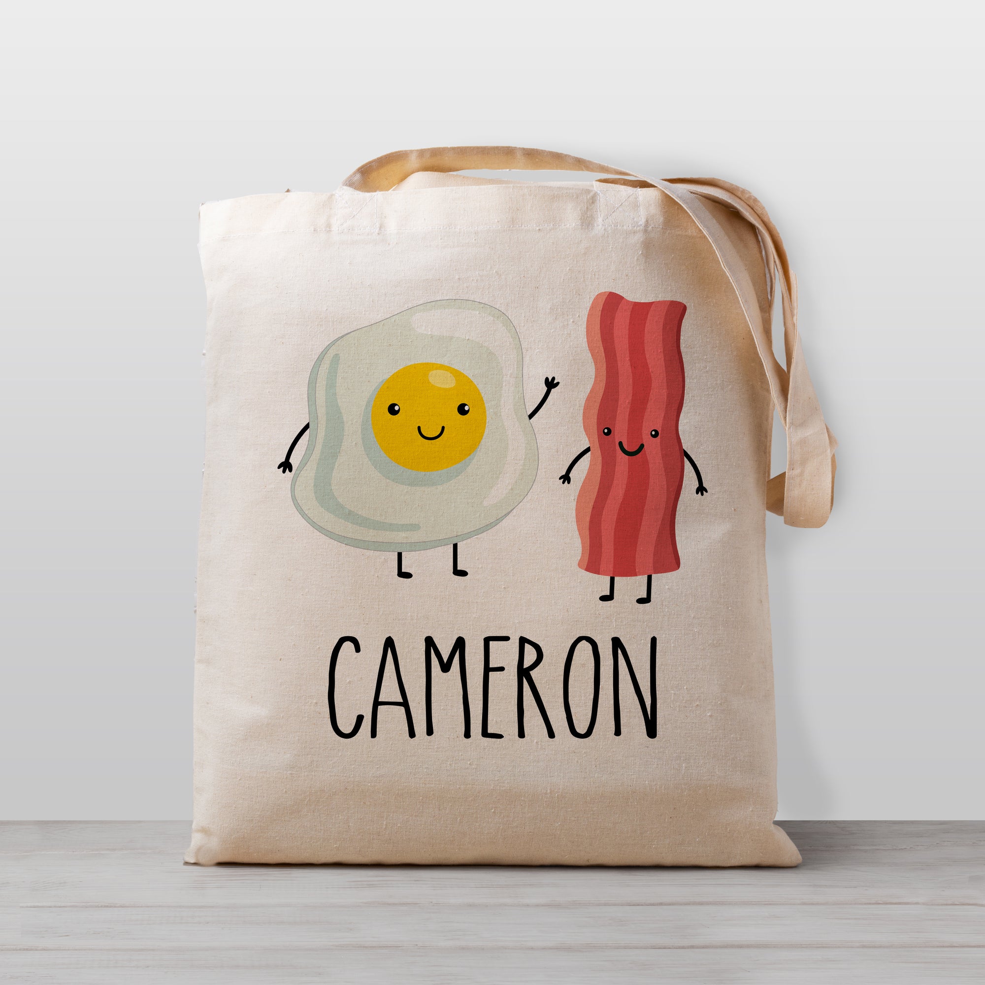 Cute Bacon and Eggs Breakfast tote bag, personalized with your child's name. 100% cotton canvas, great for daycare, preschool, kindergarten, or to use for library books