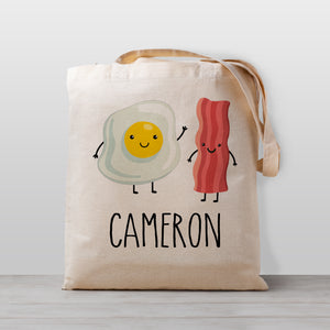 Cute Bacon and Eggs Breakfast tote bag, personalized with your child's name. 100% cotton canvas, great for daycare, preschool, kindergarten, or to use for library books