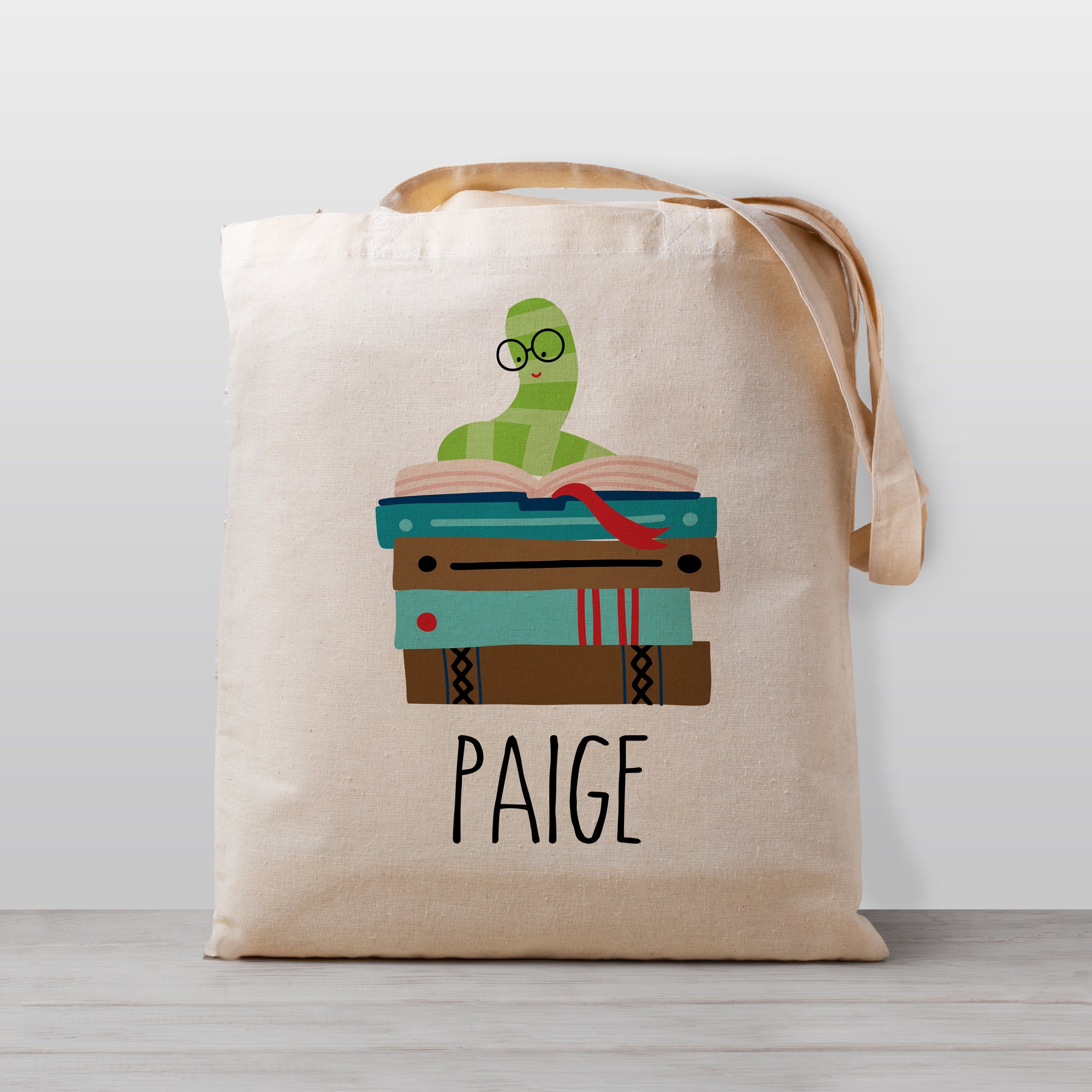 Kids library book bag, personalized with a book work on a stack of books. 100% natural cotton canvas