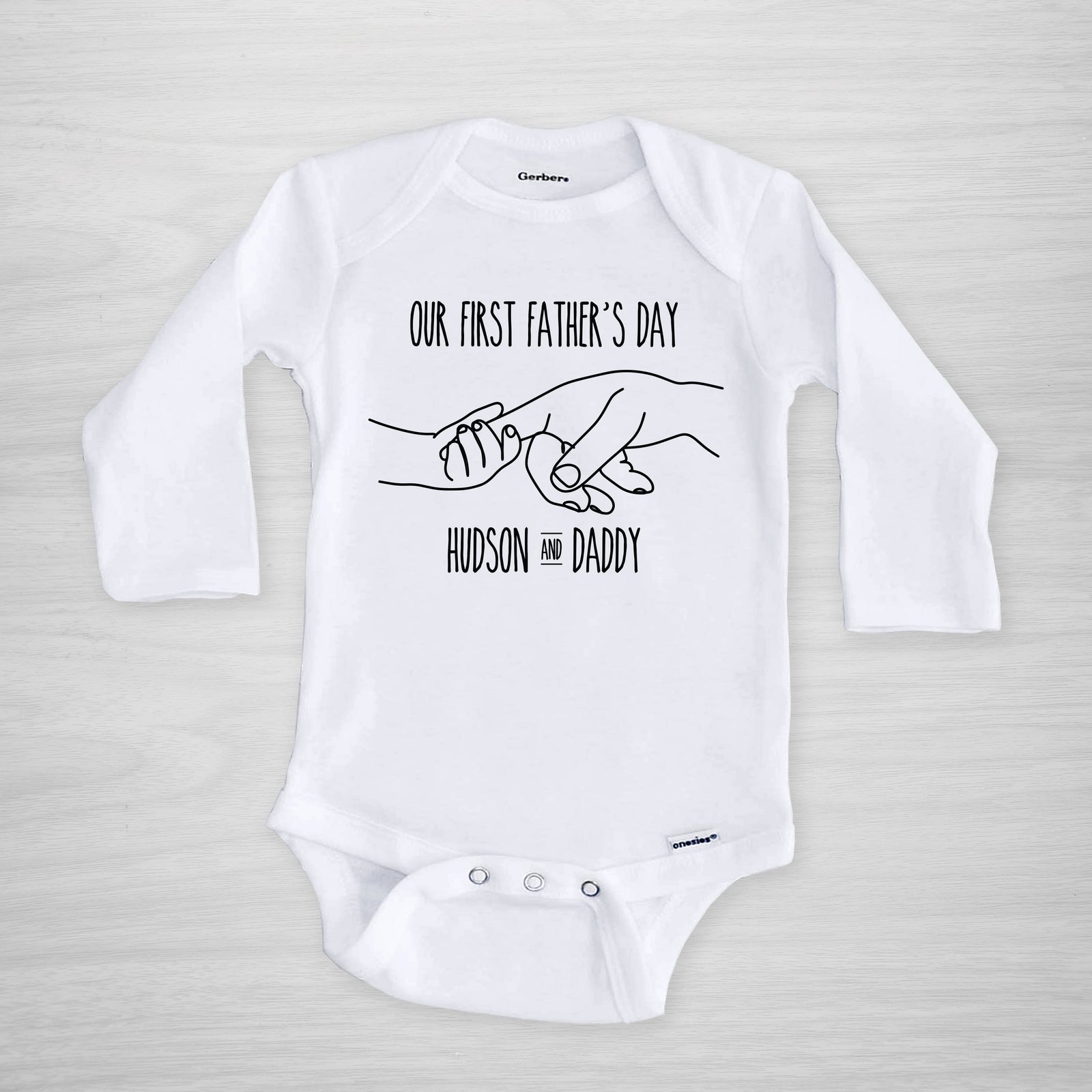 Father's Day Onesie, depicting father and child holding hands, personalized with your baby's name, short sleeved