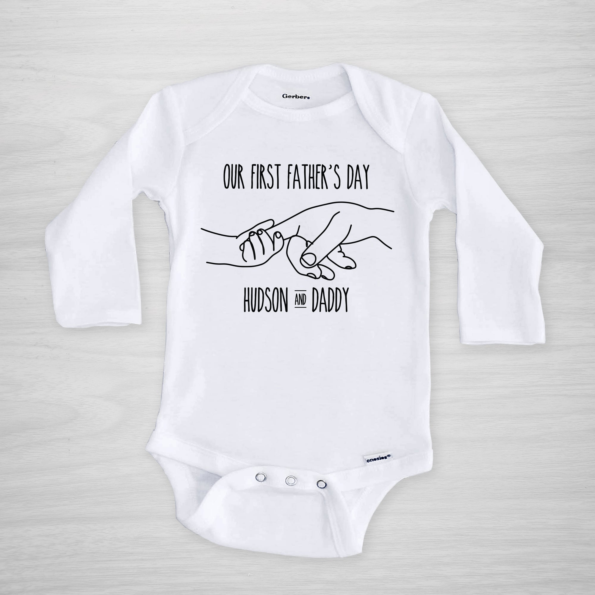 Father's Day Onesie, depicting father and child holding hands, personalized with your baby's name, long sleeved