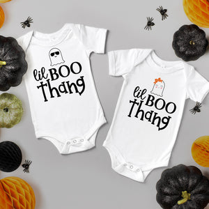 Boy and girl lil boo thang onesies. Great for twins. lil boo thang onesie with a cute ghost in aviator sunglasses. Printed in our Nashville studio short sleeved