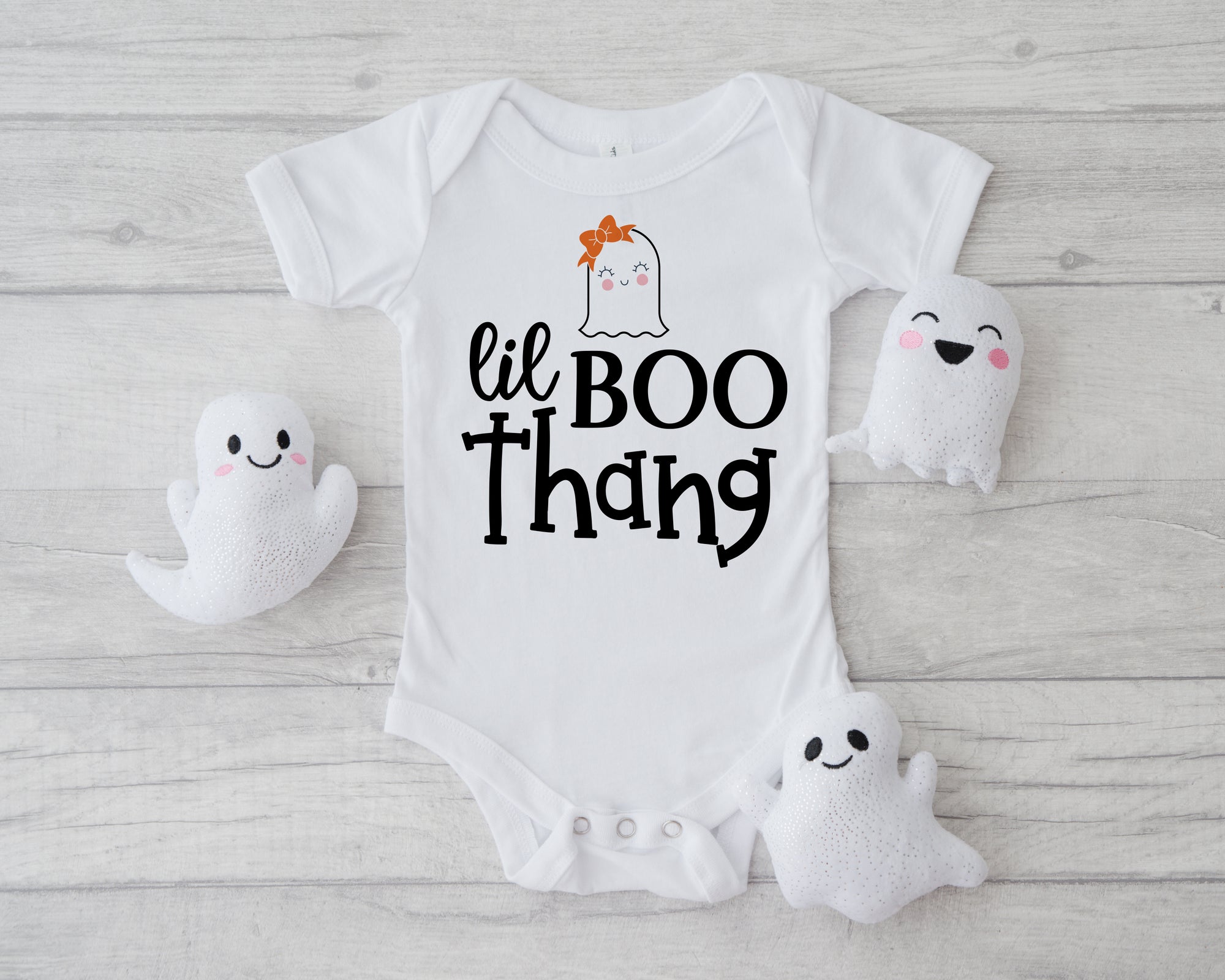 "Lil Boo Thang" Gerber onesie® with a cute ghost wearing a hair bow. Perfect for your little one's first Halloween. cute gift for new baby