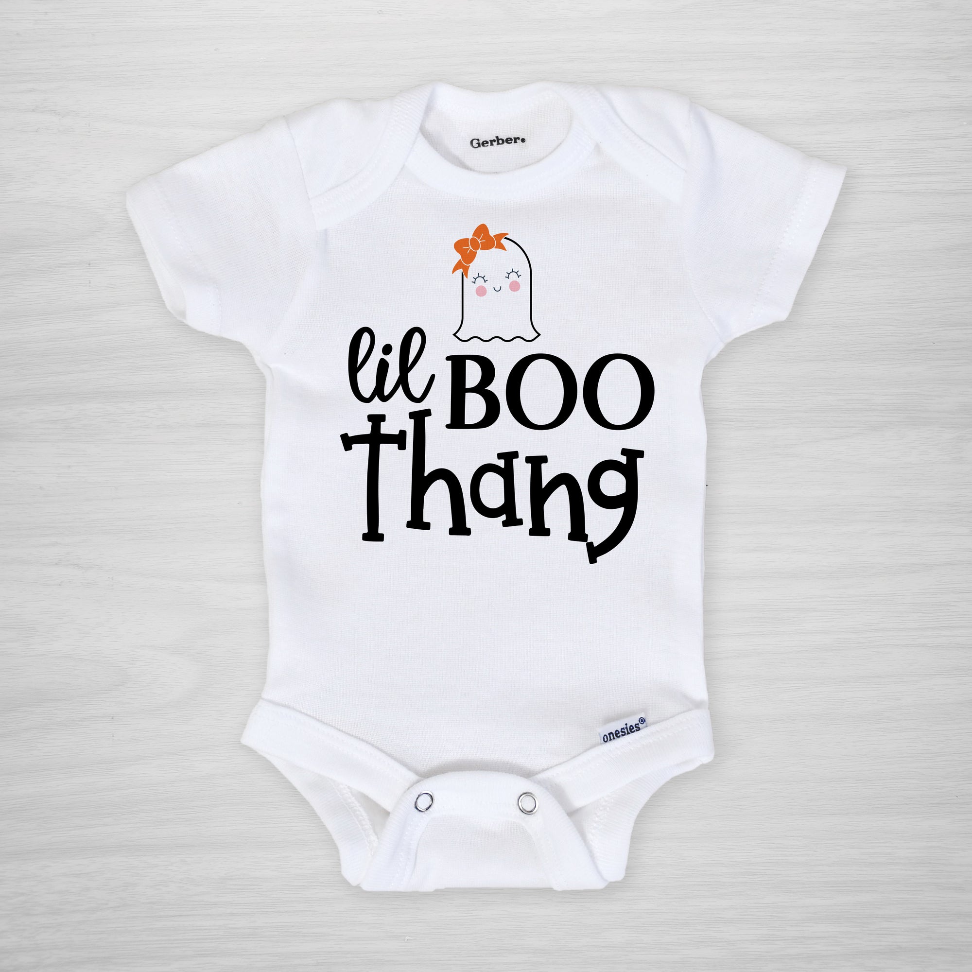 "Lil Boo Thang" Gerber onesie® with a cute ghost wearing a hair bow. Perfect for your little one's first Halloween. short sleeved
