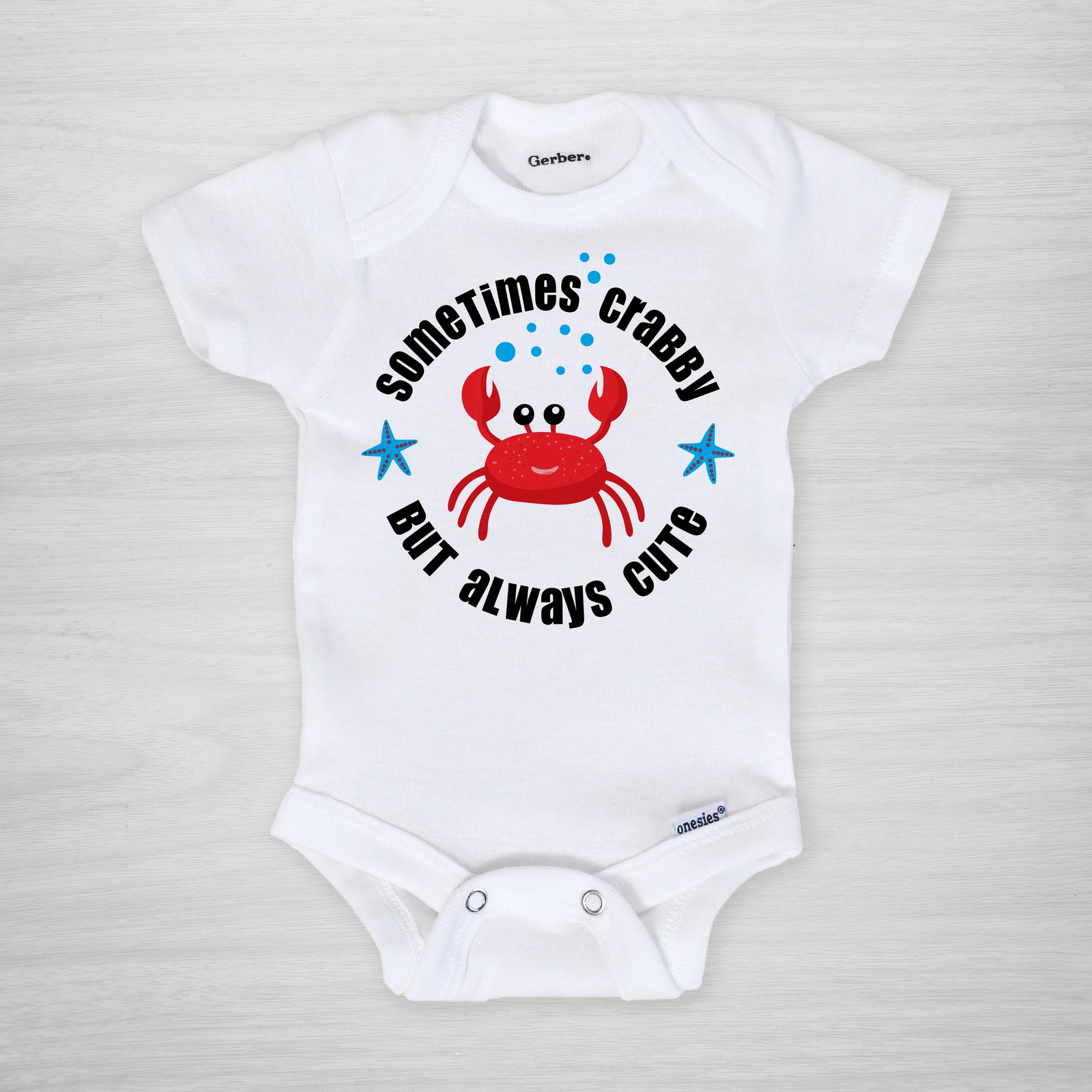 Our Sometimes Crabby Onesie is just the right pick for crabby cuties everywhere! This Gerber Onesie® is made with 100% cotton for softness and comfort and features a vibrant crab design with the phrase "Sometimes Crabby But Always Cute". Great for keeping your little one comfy and stylish! Short Sleeved