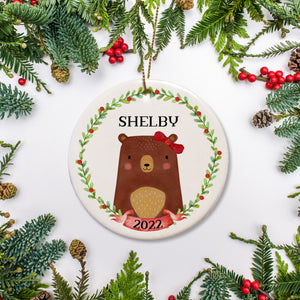 Girl Bear in green and berry wreath | Bear has rosy cheeks and a bow on one ear | Keepsake Christmas Ornament | Personalized Christmas ornament | Pipsy.com