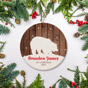 Bear silhouette with Wood background | Personalized Ornament with name in red | 1st Christmas and year in brown block text | Baby's First Christmas | Pipsy.com