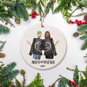 Best Friends Personalized ChristmasOrnament Backs of two friends in leather jackets that spell out best friends when they stand together. Each one holding out the hands with the peace sign. Choose hair color and personalized with name and year of your choice| Pipsy.com