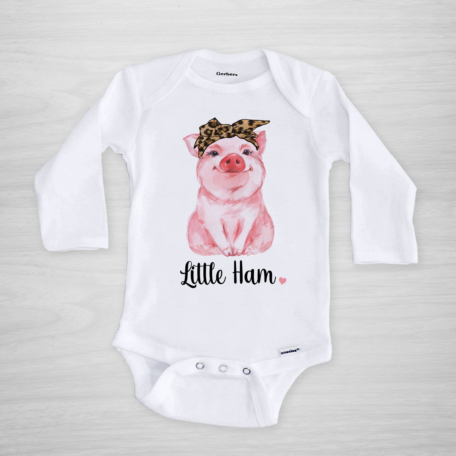 Little Ham Onesie - A cute pig with a cheetah leopard headband printed on a genuine Gerber onesie®, short sleeved