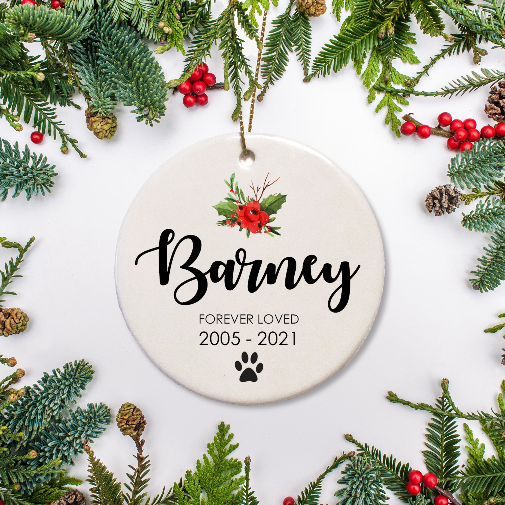 Forever loved pet name in script across the center of the Christmas Ornament. Paw print at the bottom and name and years below - Pet memorial gift, keepsake for your pet | PIPSY.COM