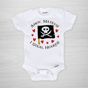Pirate onesie for Valentine's Day. A cute pirate flag, with text that reads "Ahoy Mateys! I steal hearts!"  Printed on a genuine Gerber onesie® and hand pressed in Pipsy's Nashville studio, short sleeved