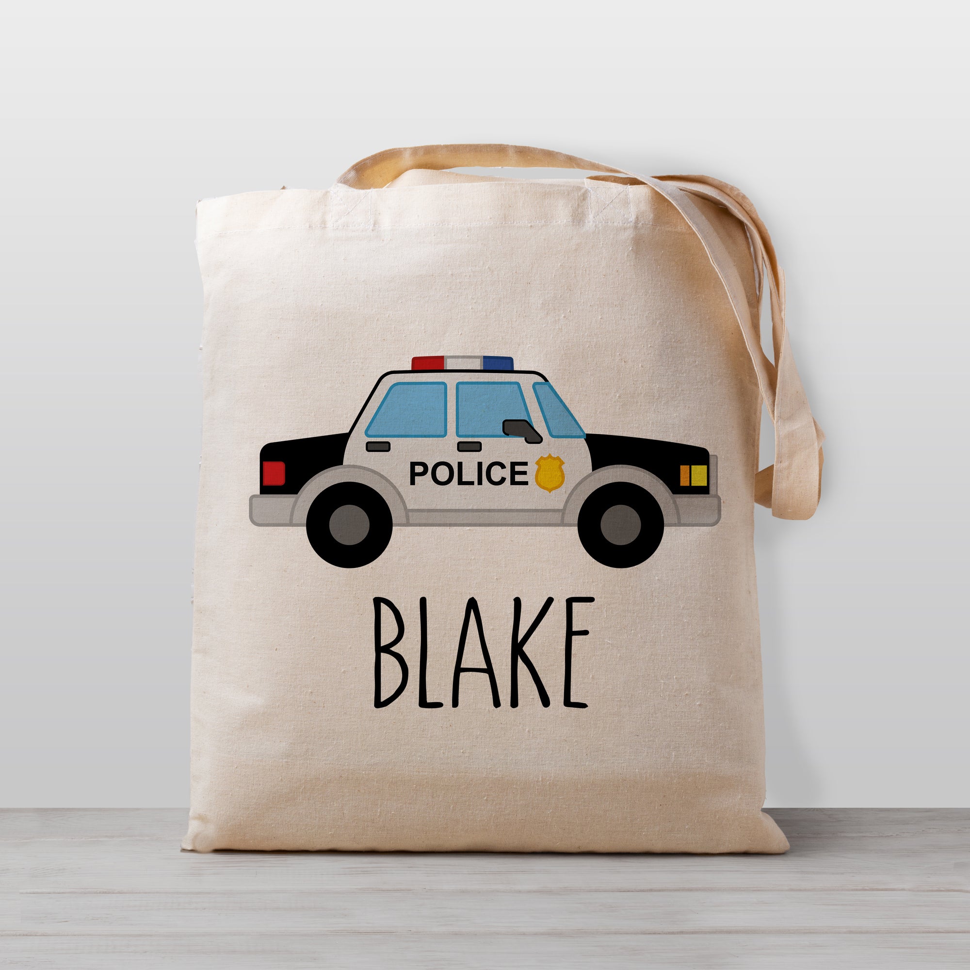 police car tote bag for boys and girls, personalized with name, 100% cotton canvas, popular for daycare, preschool, and carrying toys in the car